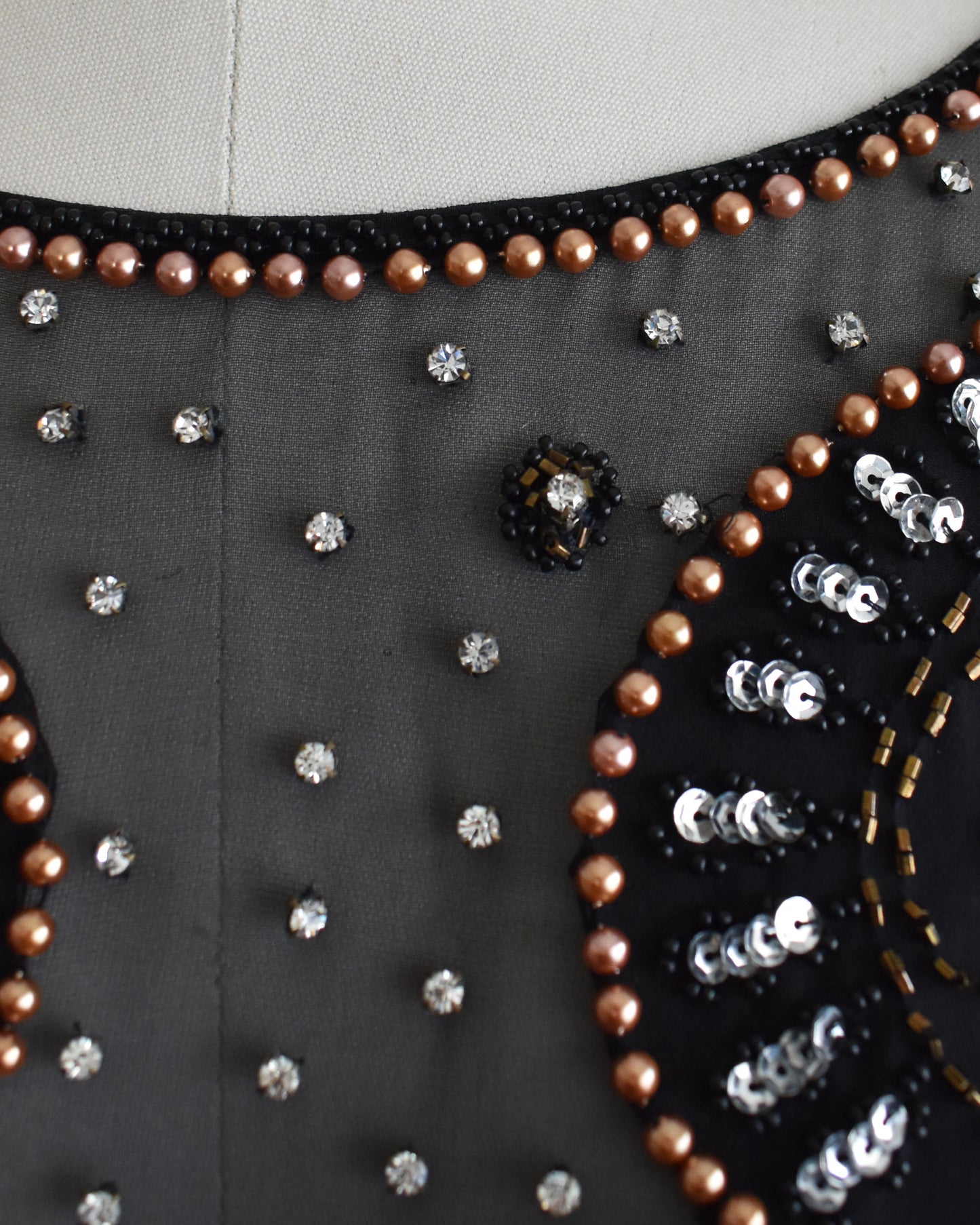 close up of the rhinestone neckline