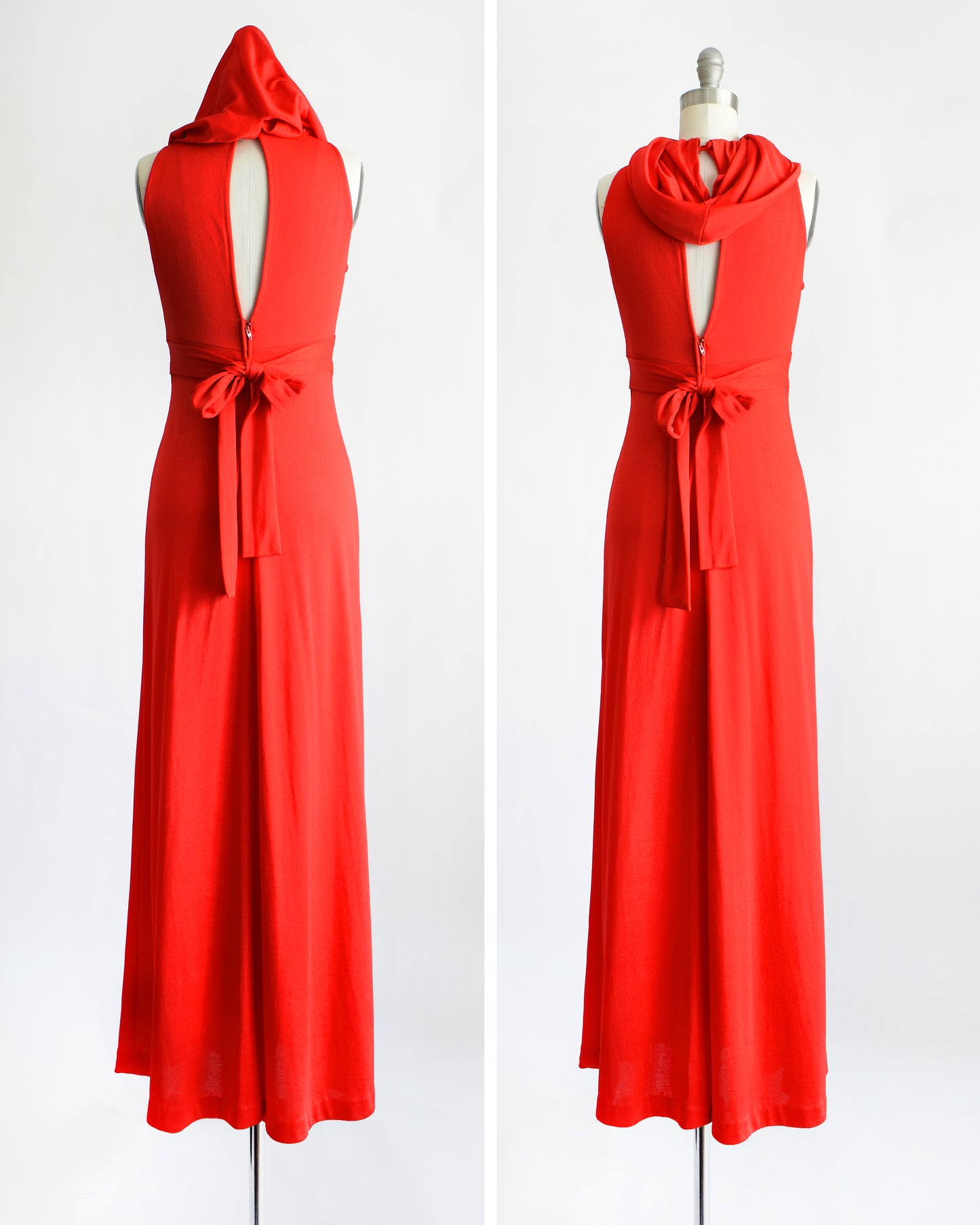 A bright red sleeveless maxi dress with a draped hood and a matching fabric tie belt at the waist, shown with the hood up and down on a white mannequin against a white background.