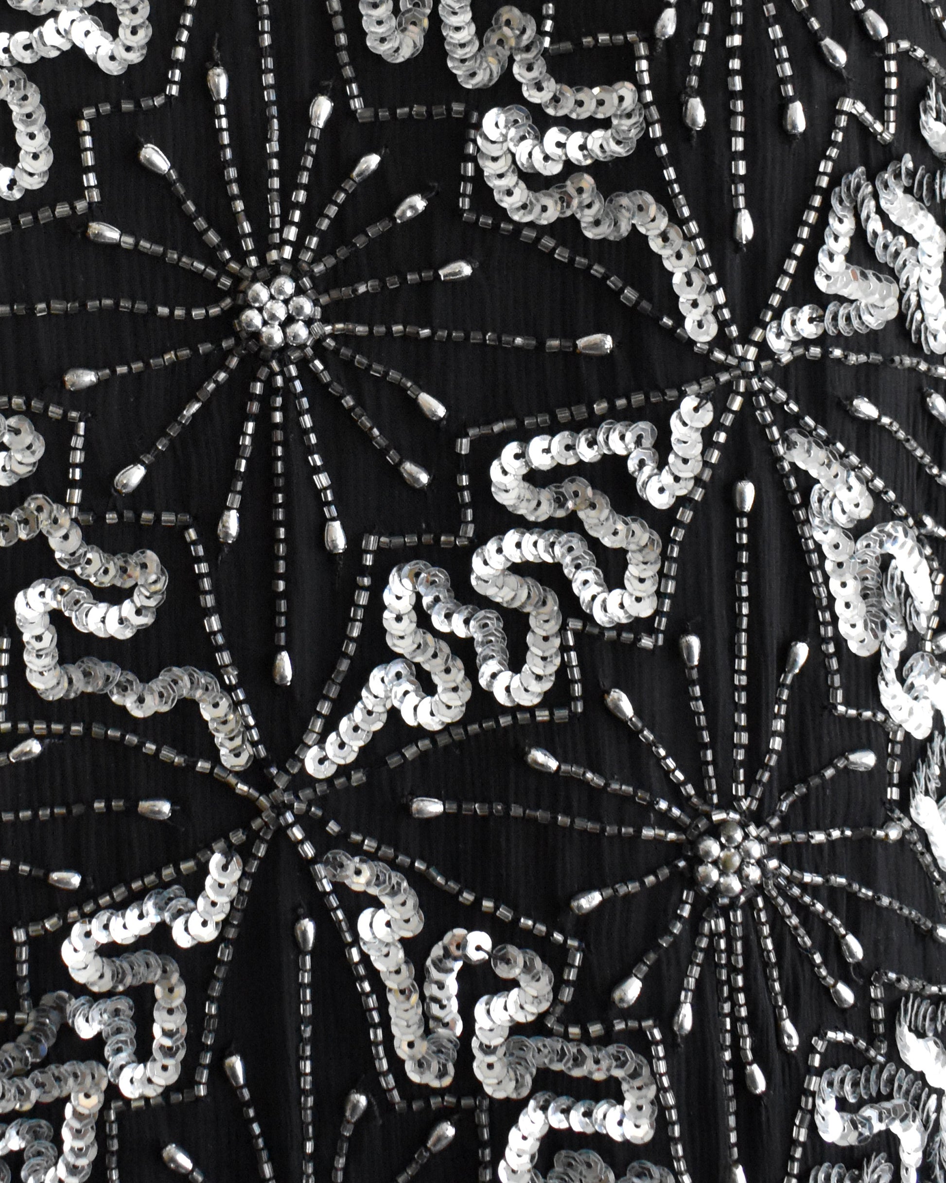 close up of the beaded and sequin starburst pattern