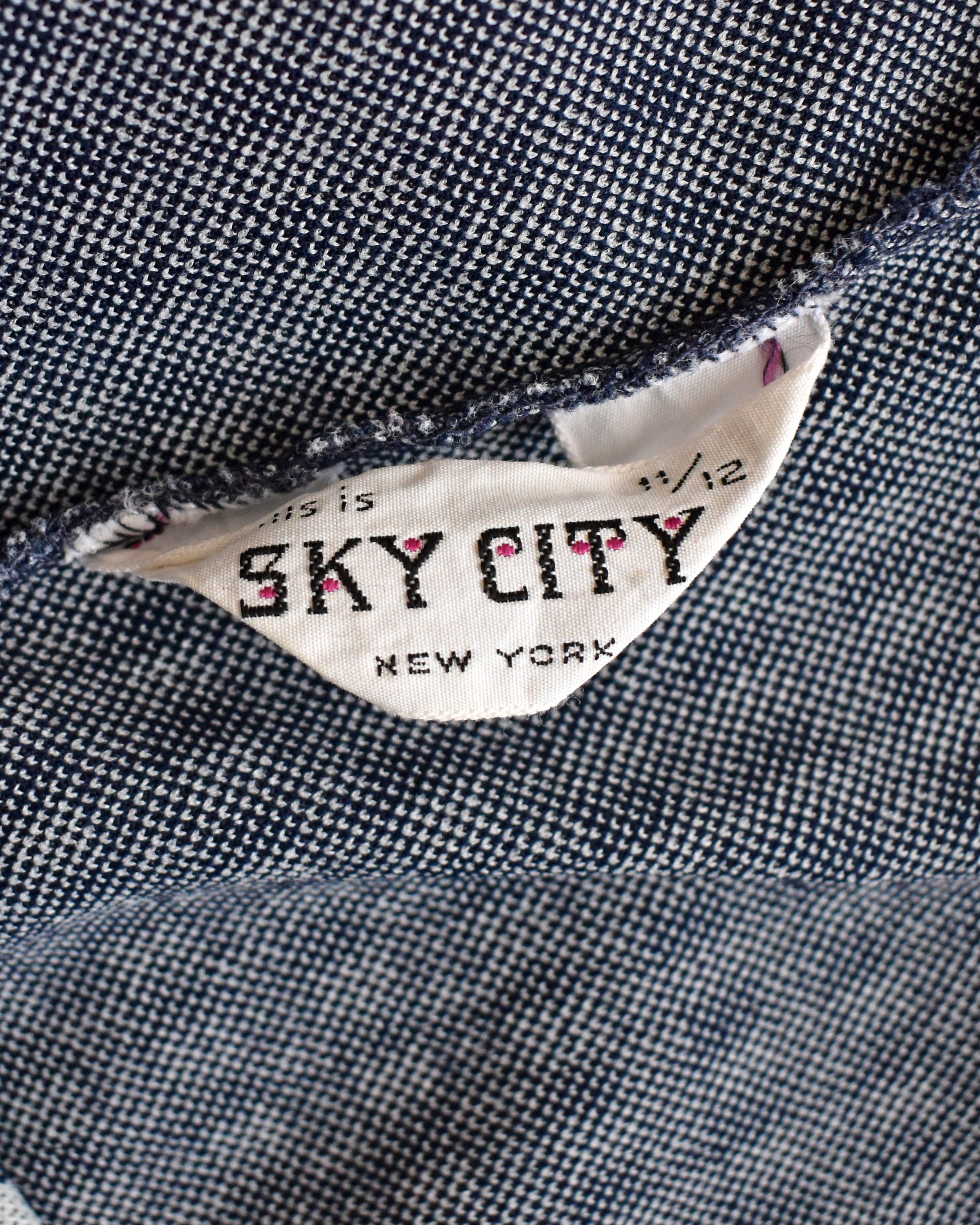 close up of the tag which says this is sky city new york