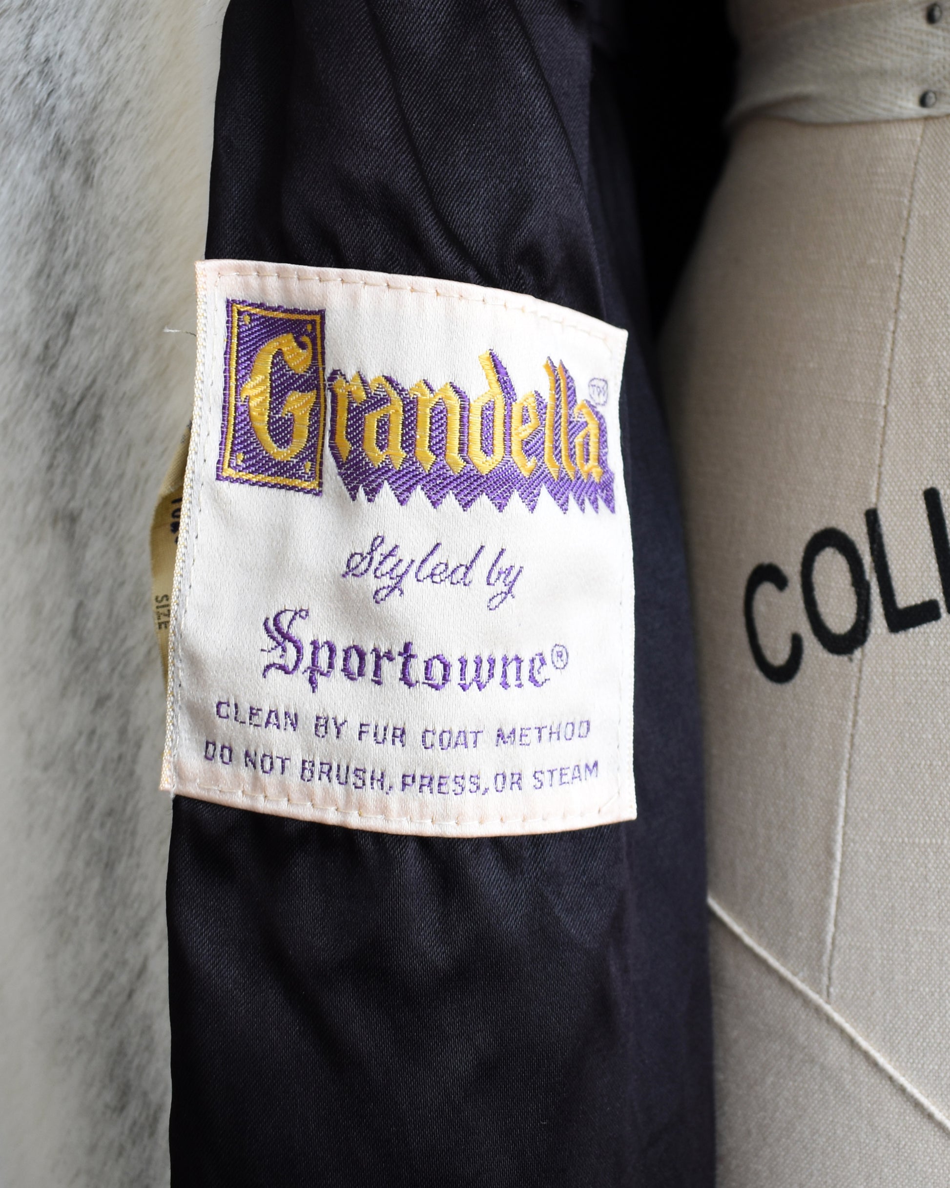 close up of the tag which says Grandella styled by Sportowne