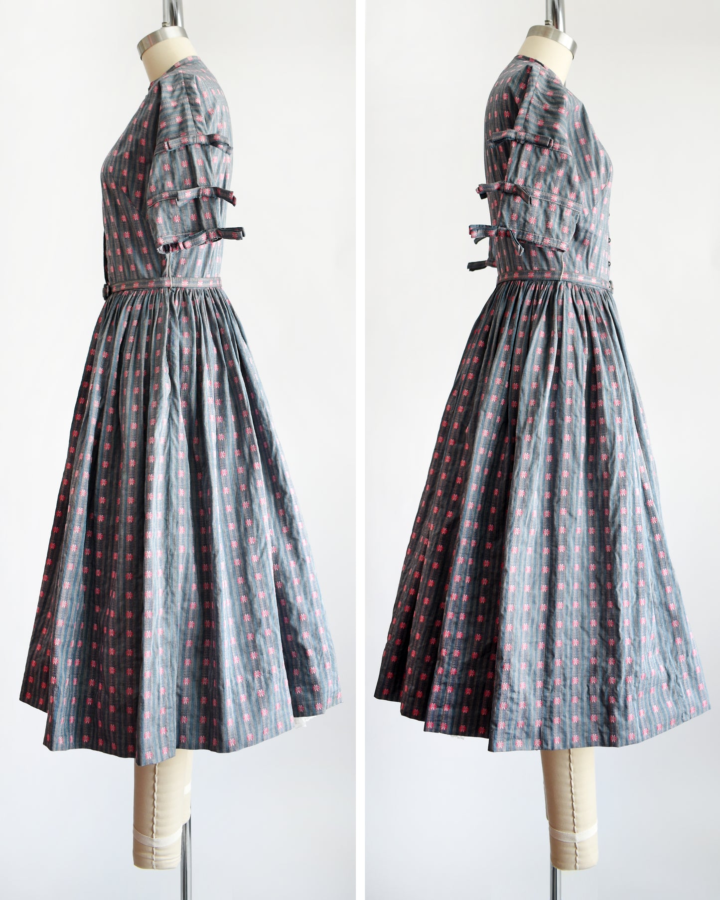 side by side views of a vintage 1950s Jonathan Logan dress displayed on a mannequin against a plain white background. The dress features a gray base with a pink floral pattern, short sleeves with tie details at the cuffs, and a button-up front.