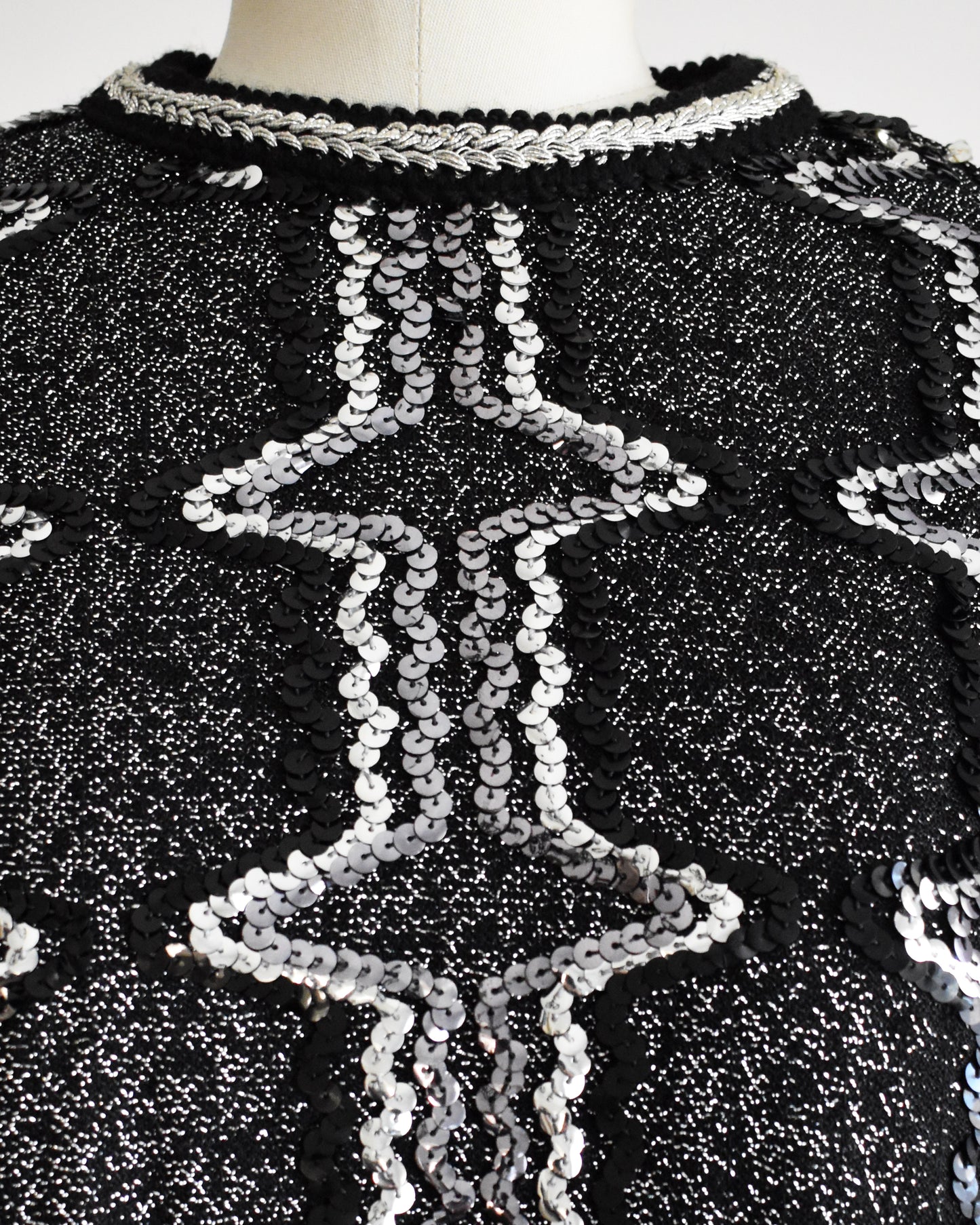 close up of the sequin and metallic detail