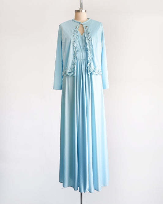 a vintage 70s light blue maxi dress with  matching jacket on a dress form