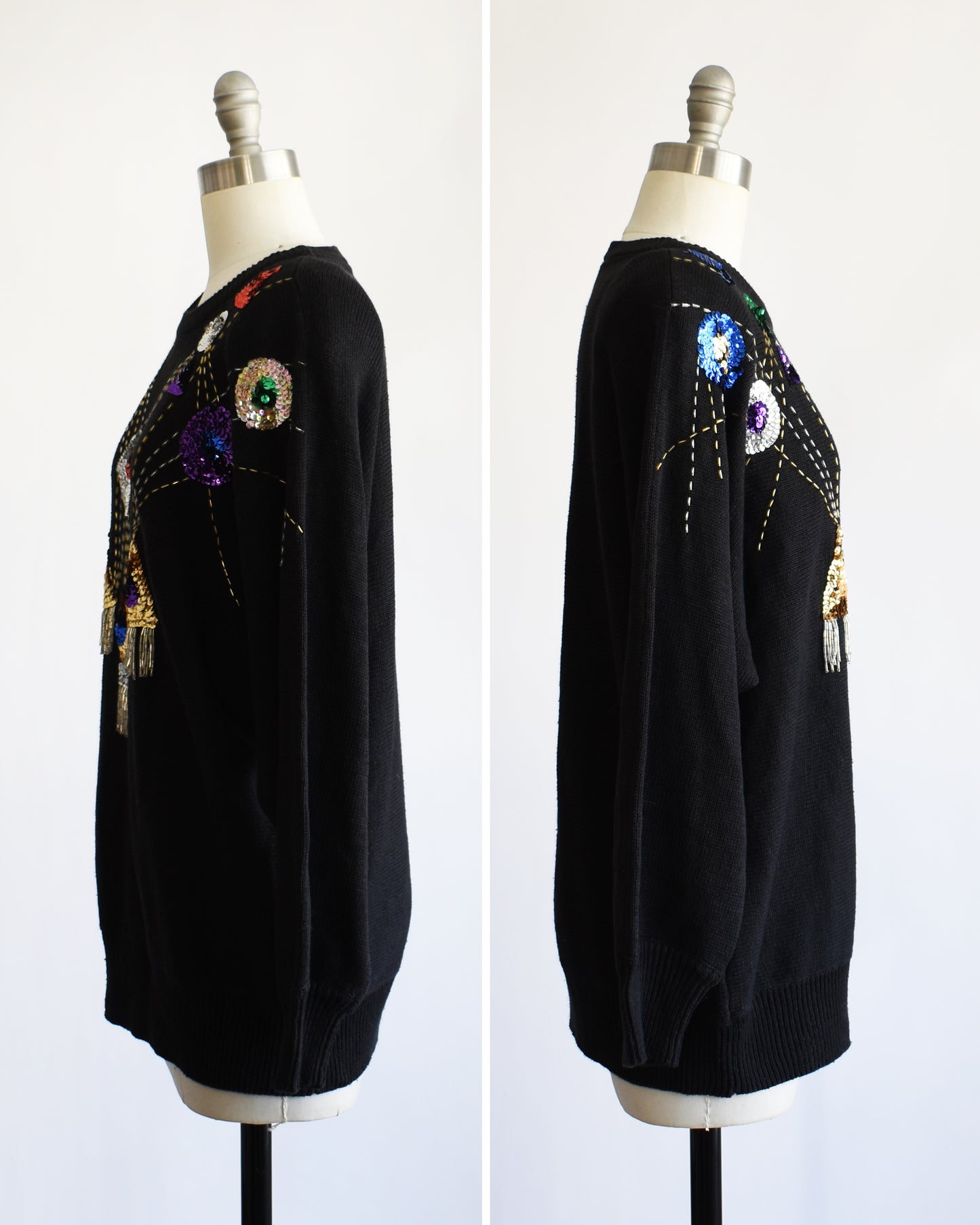 side by side front view of a vintage black sweater with colorful gemstone sequins and tassel details on a mannequin against a white background