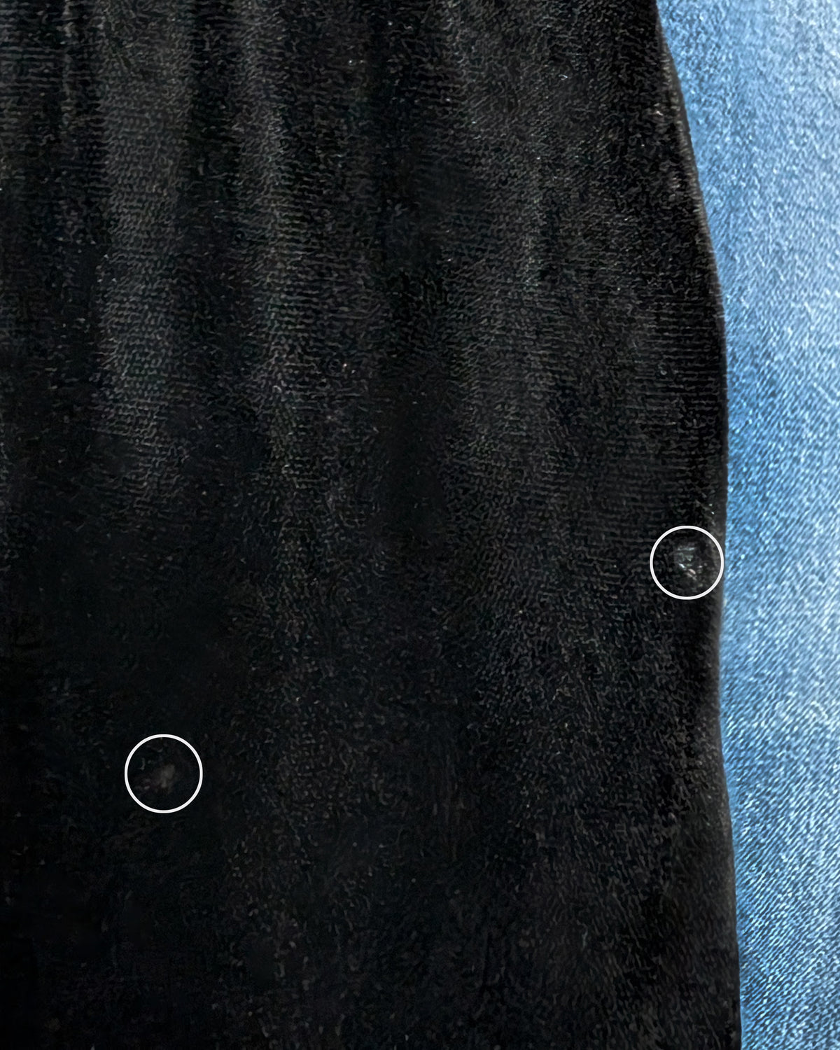 close up showing two light spots on the side of the skirt on the velvet