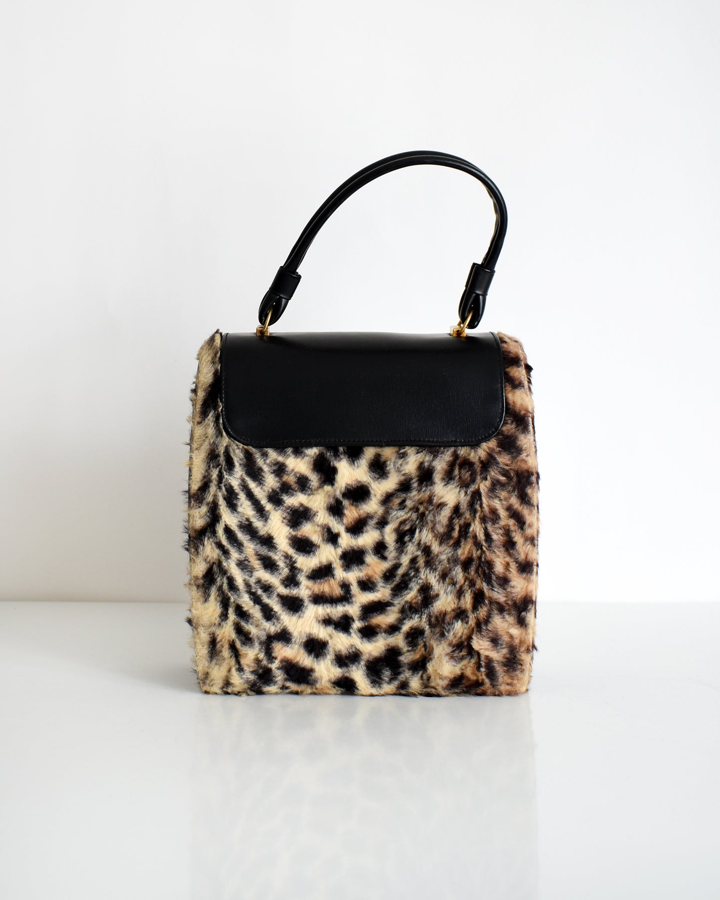 back view of a vintage 1950s faux leopard print purse 