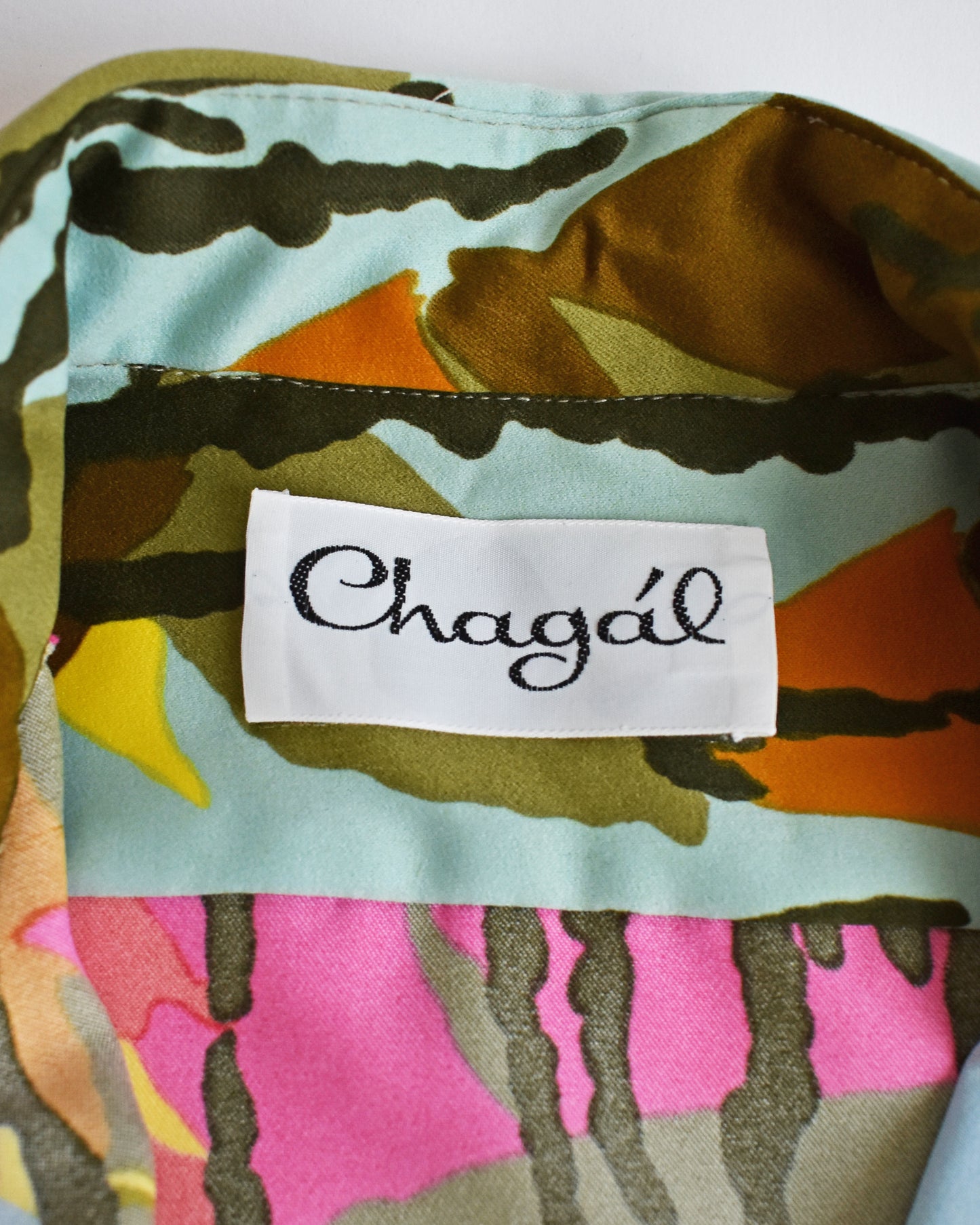 Close-up of the label reading 'Chagál' in black script.