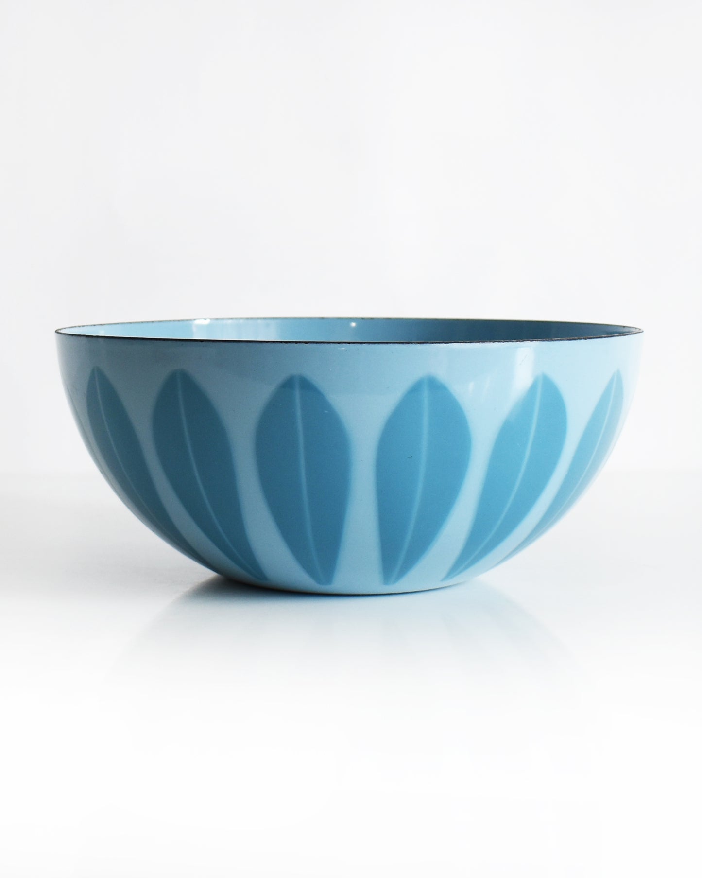 a vintage 1960s Cathrineholm lotus bowl against a white background
