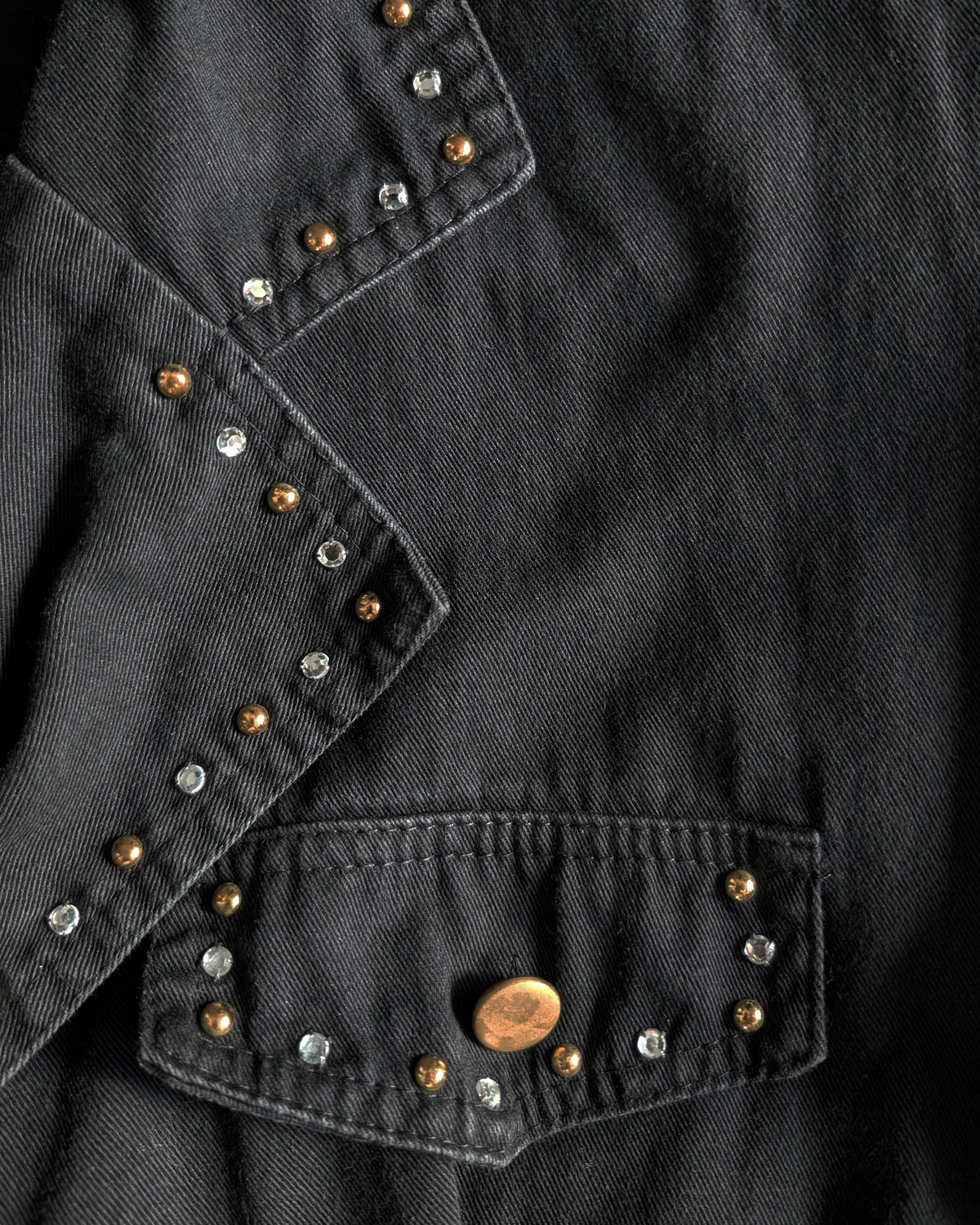 close up of the studs and rhinestones on the lapel and pocket flap