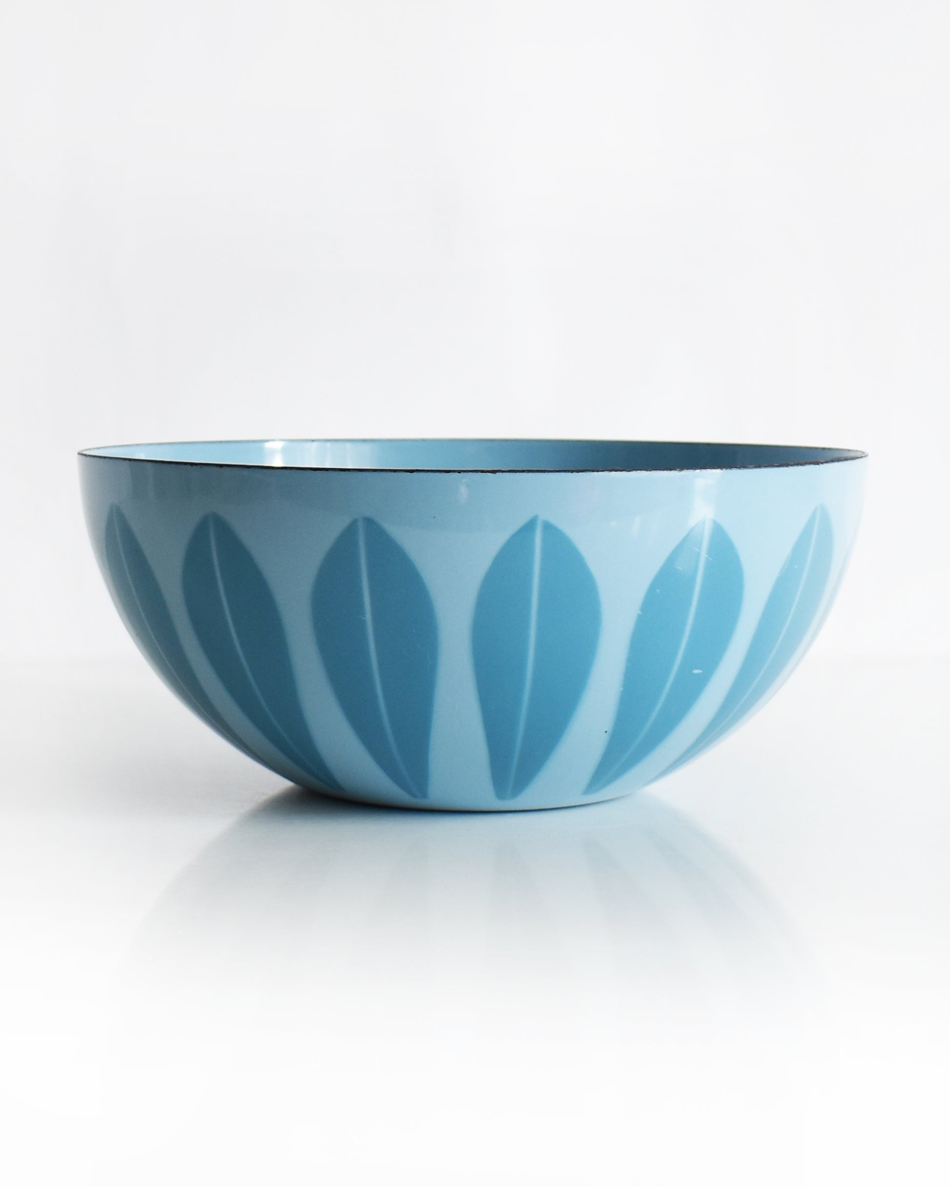a vintage 1960s Cathrineholm lotus bowl against a white background