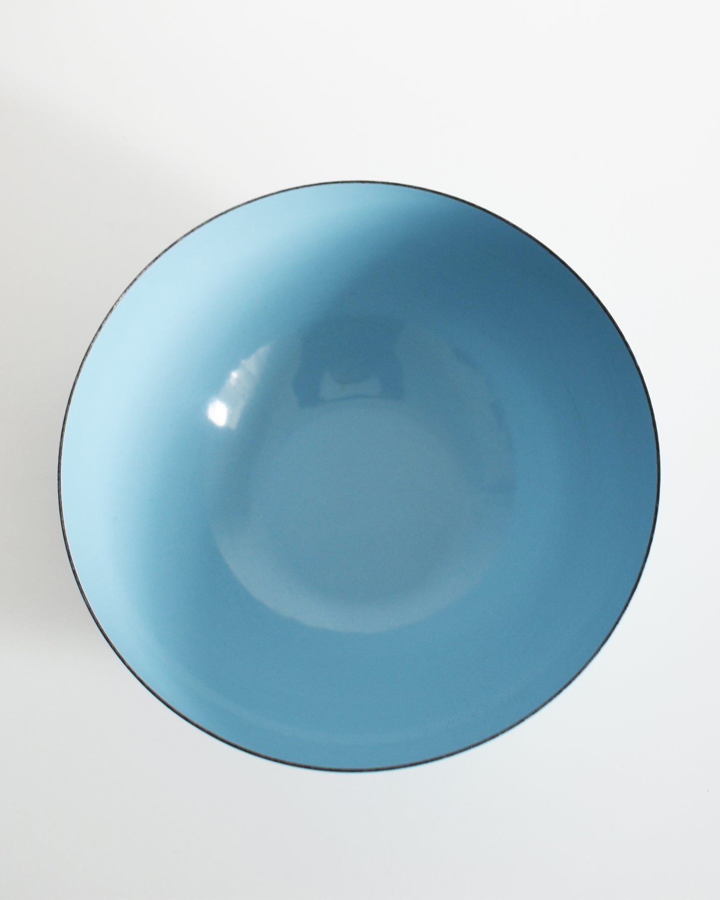 an overhead shot of a vintage 1960s Cathrineholm lotus bowl against a white background