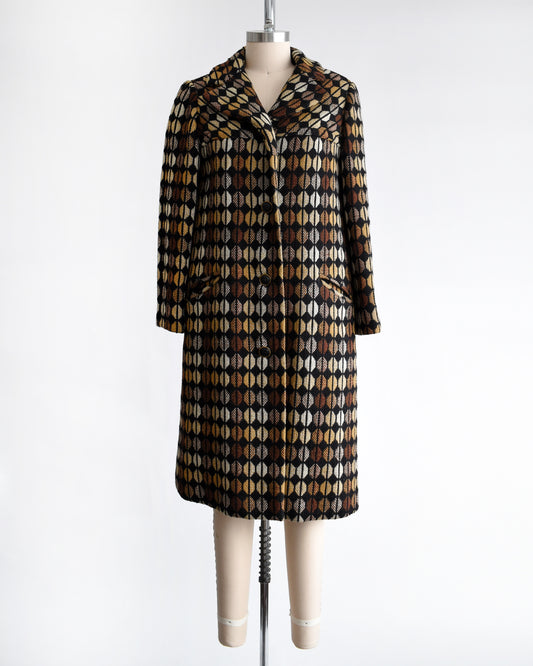 a vintage 1970s black and brown patterned coat on a mannequin against a white background