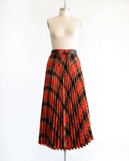 a vintage 1970s red plaid skirt on a mannequin against a white background
