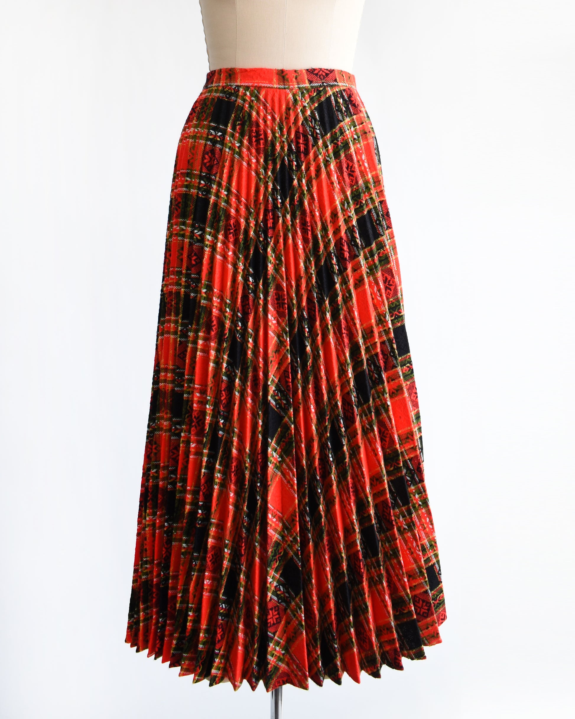 front view a vintage 1970s red plaid skirt on a mannequin against a white background. there's no belt in the photo