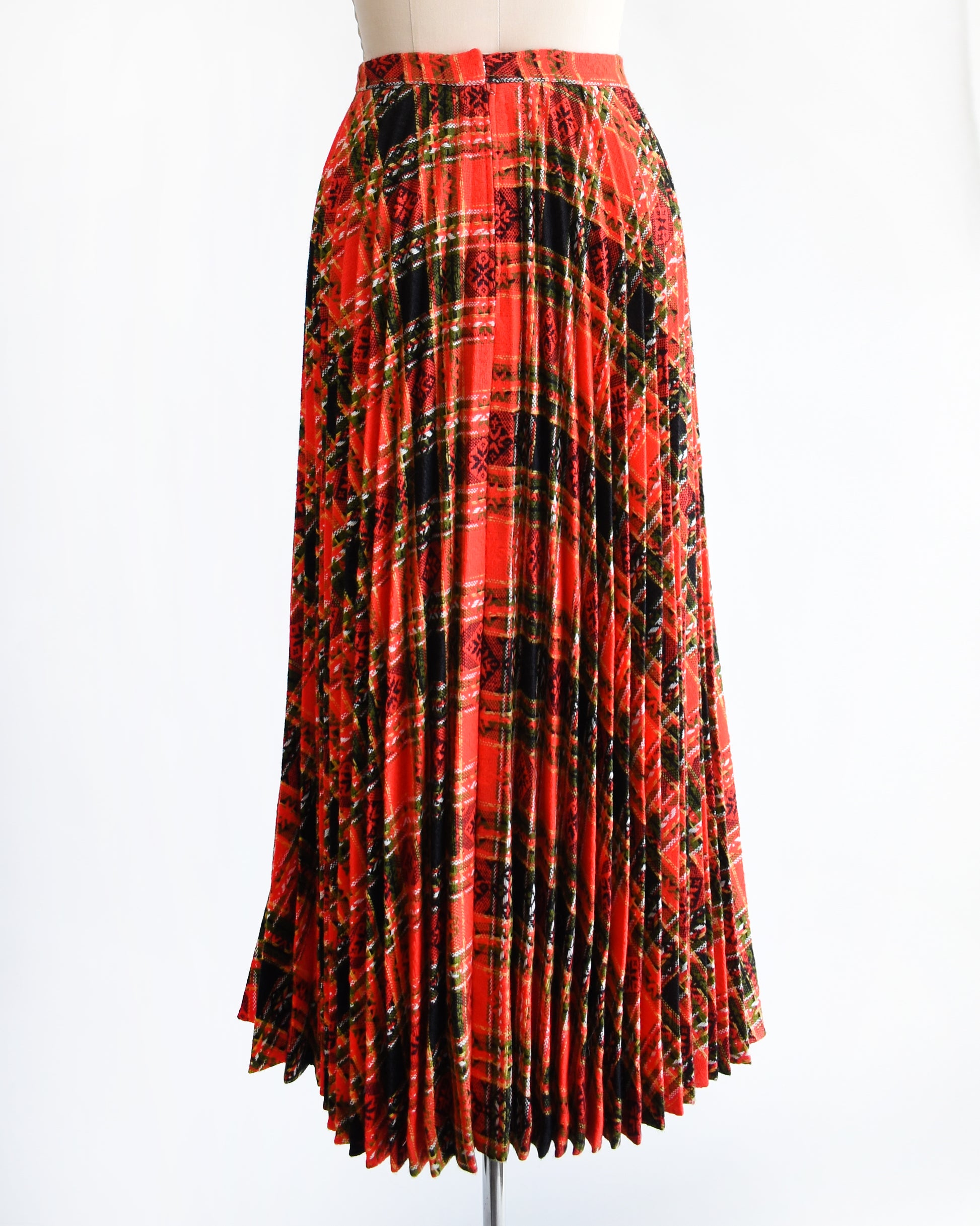 back view of front view a vintage 1970s red plaid skirt on a mannequin against a white background. there's no belt in the photo