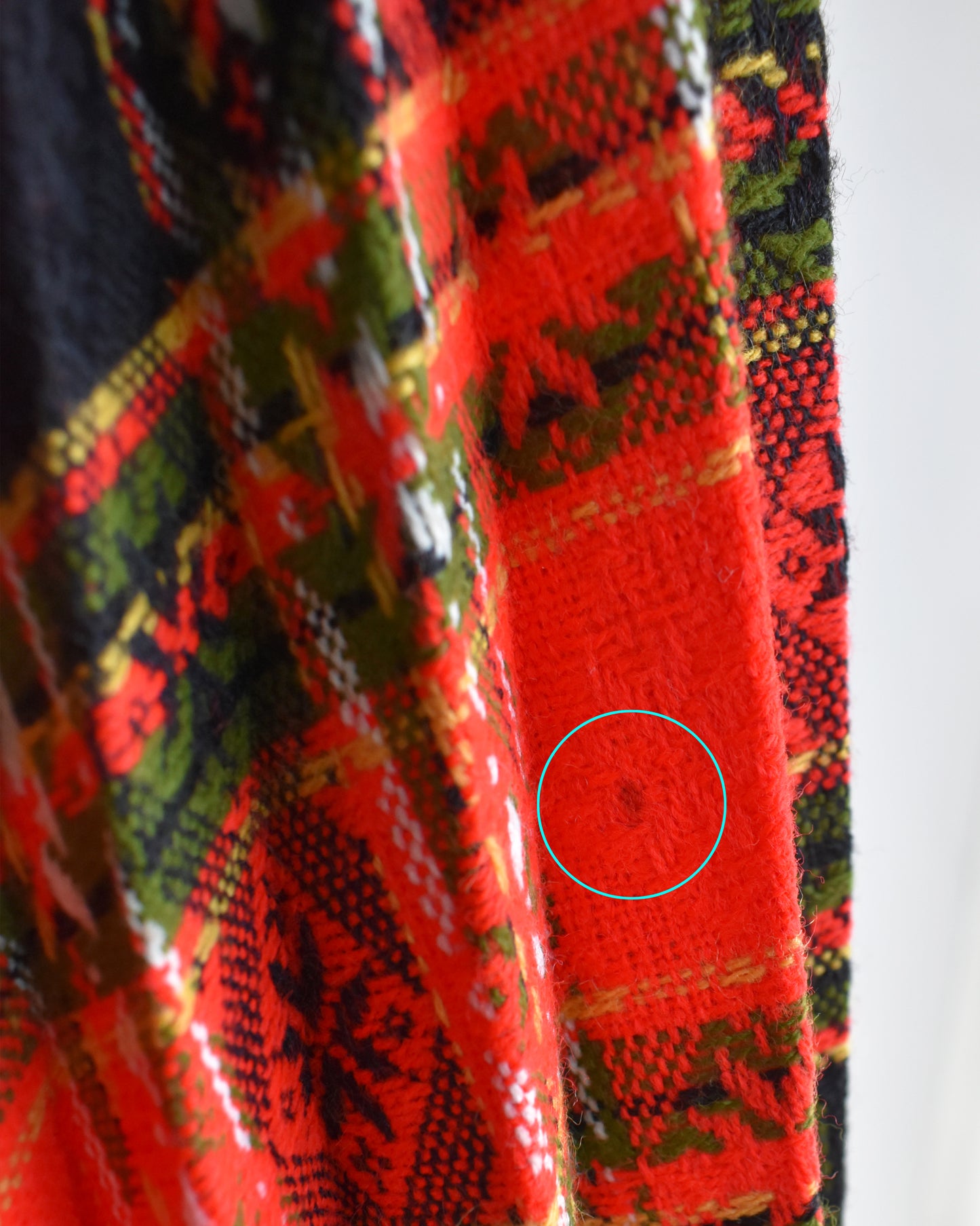 Close-up of some small missing fabric on the skirt