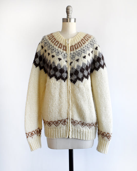 a vintage 1970s Fair Isle zip up sweater on a mannequin against a white background