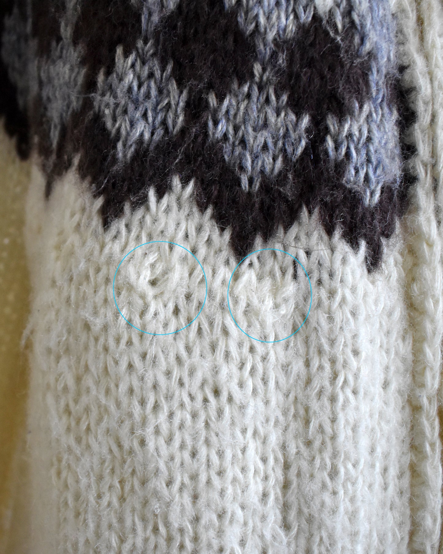 Close-up of a few small pulls in the knit