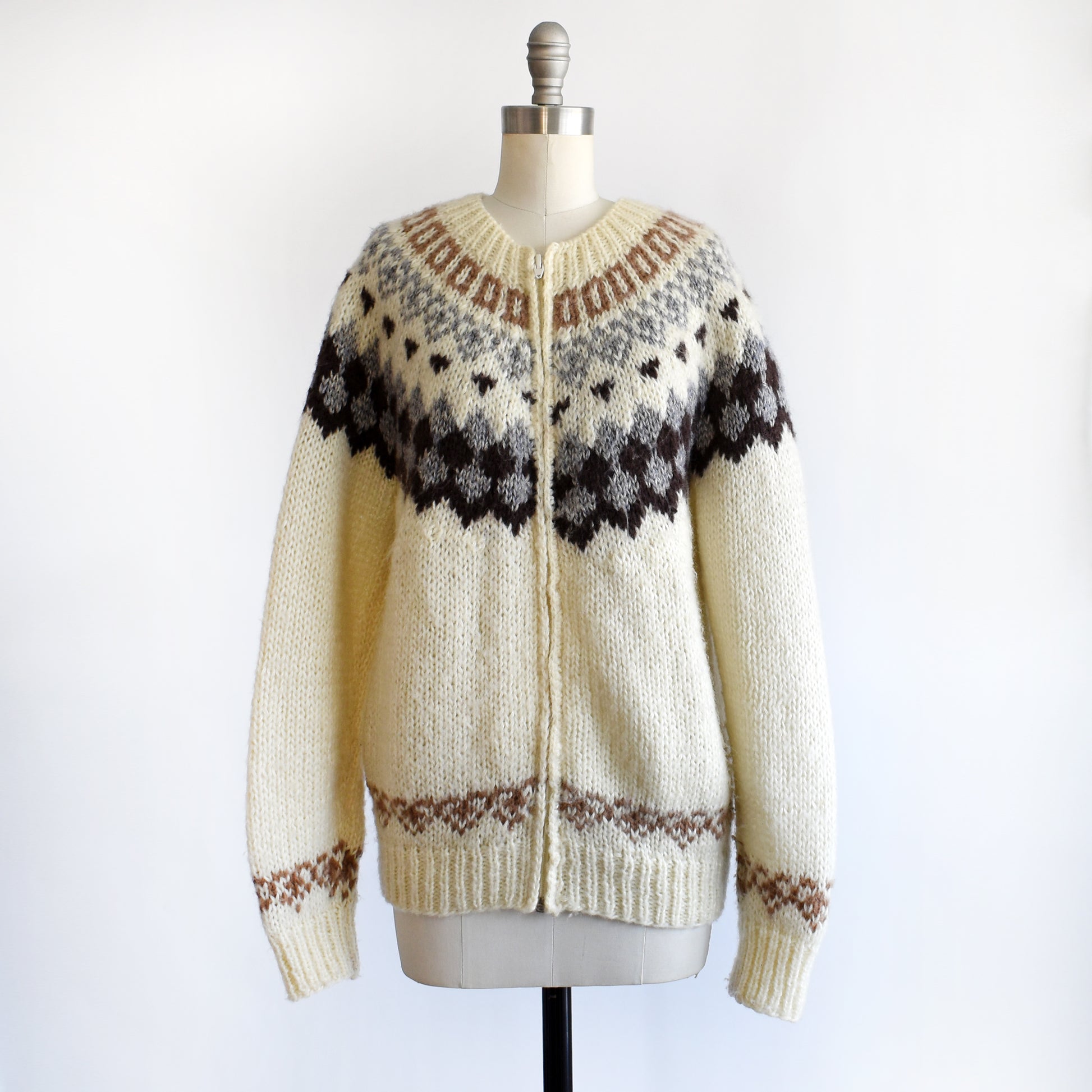 side front view of a vintage 1970s Fair Isle zip up sweater on a mannequin against a white background