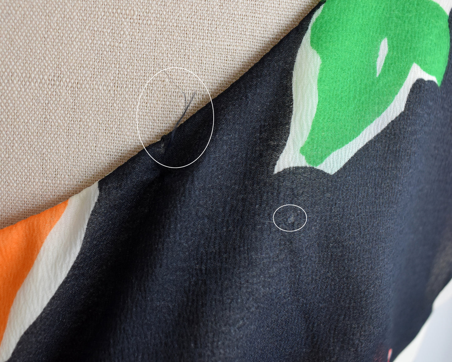 close up of two small pulls on the back of the jumpsuit