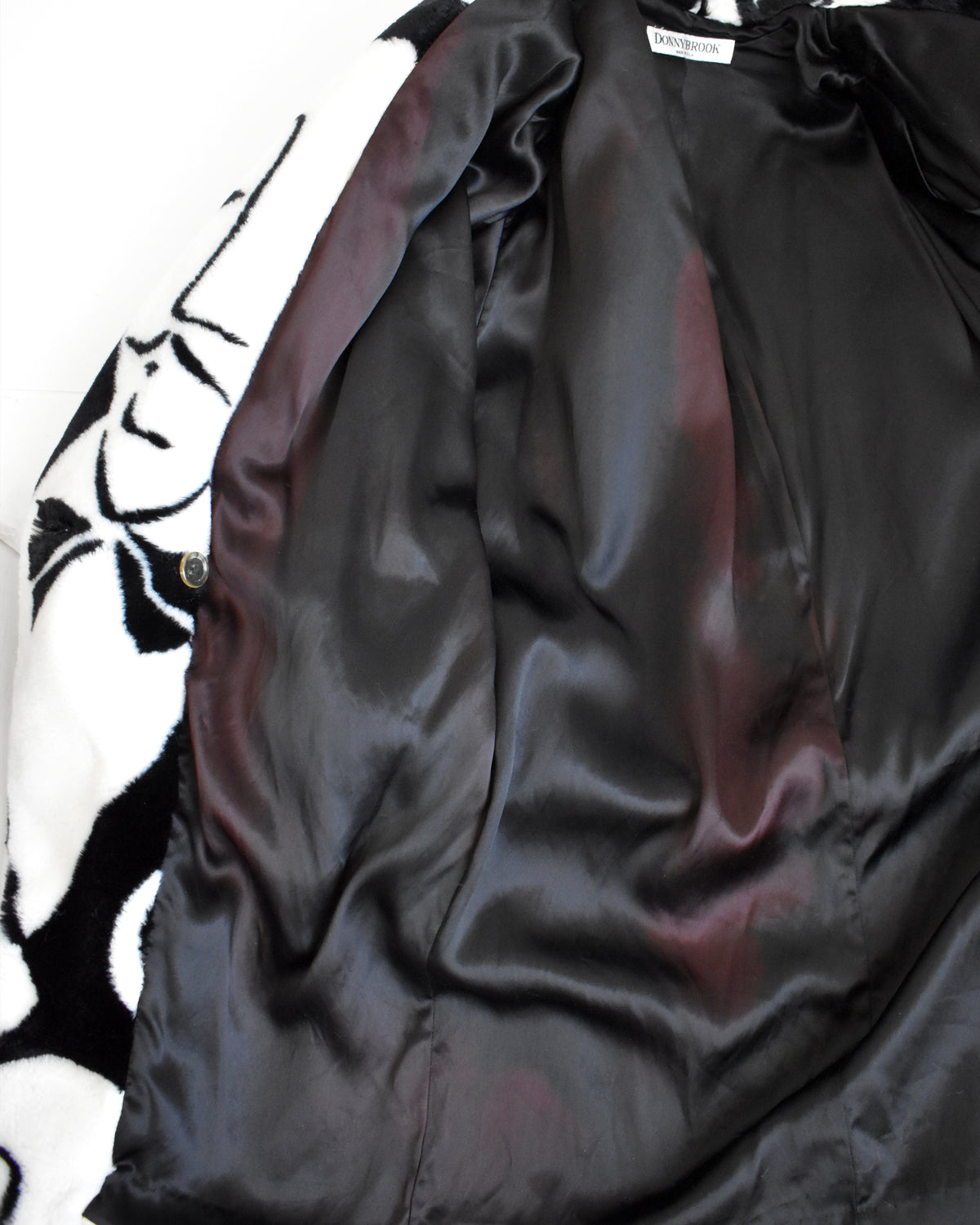 a close up of the lining of the jacket that shows some fading throughout