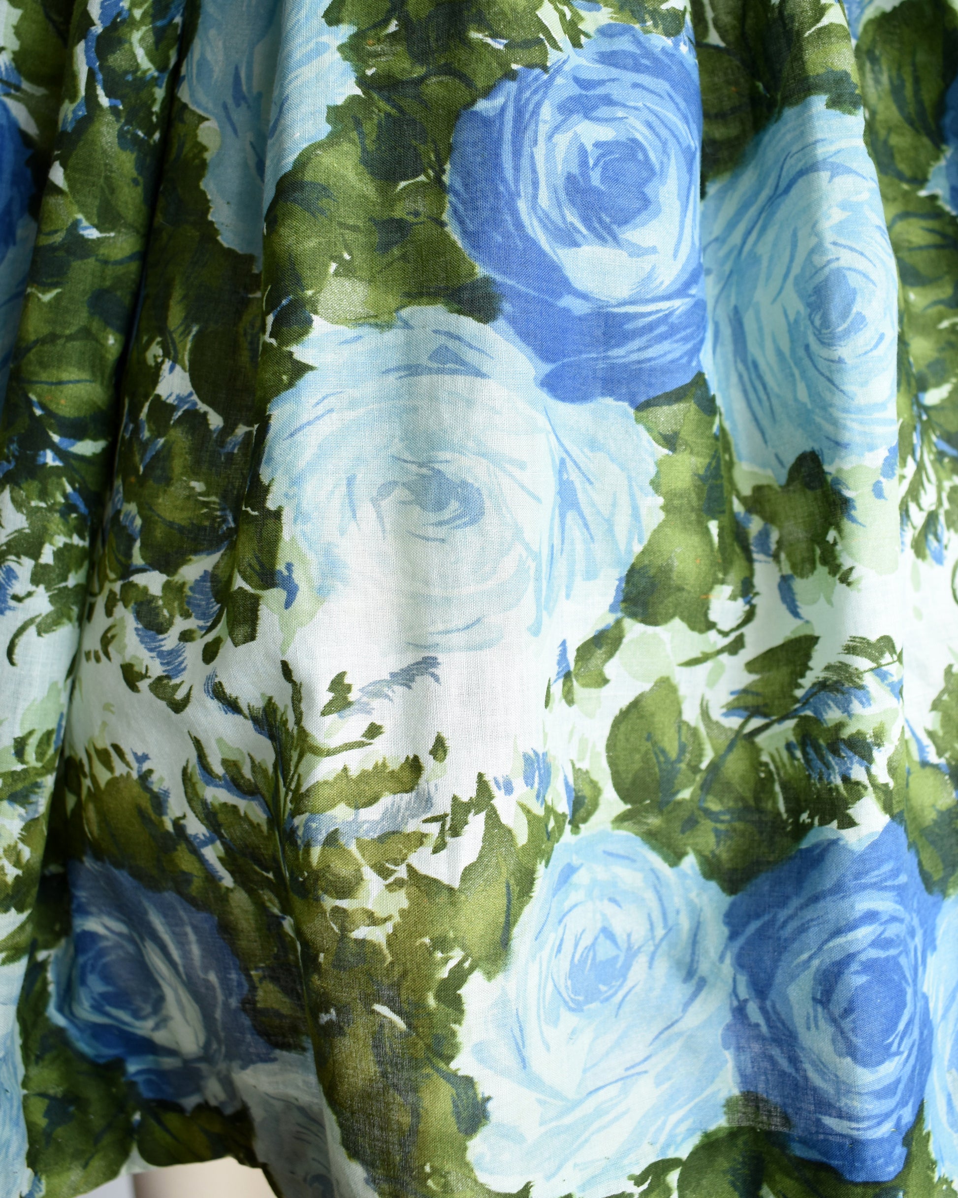 Close up of the blue and green floral print on the skirt