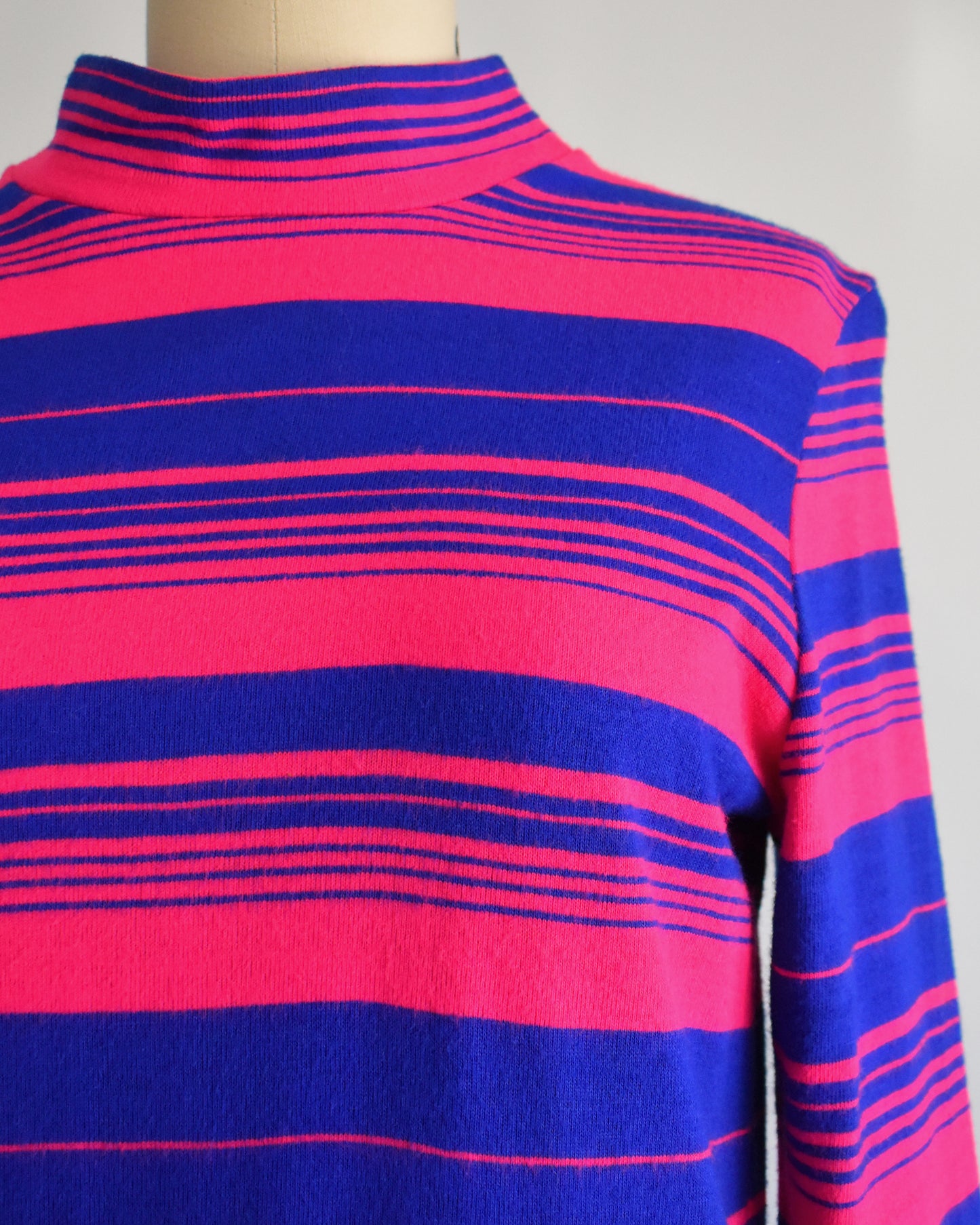 close up of the pink and blue stripes on the bodice of the dress