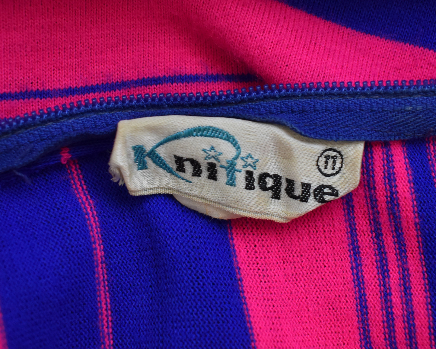 close up of the tag which says Knitique