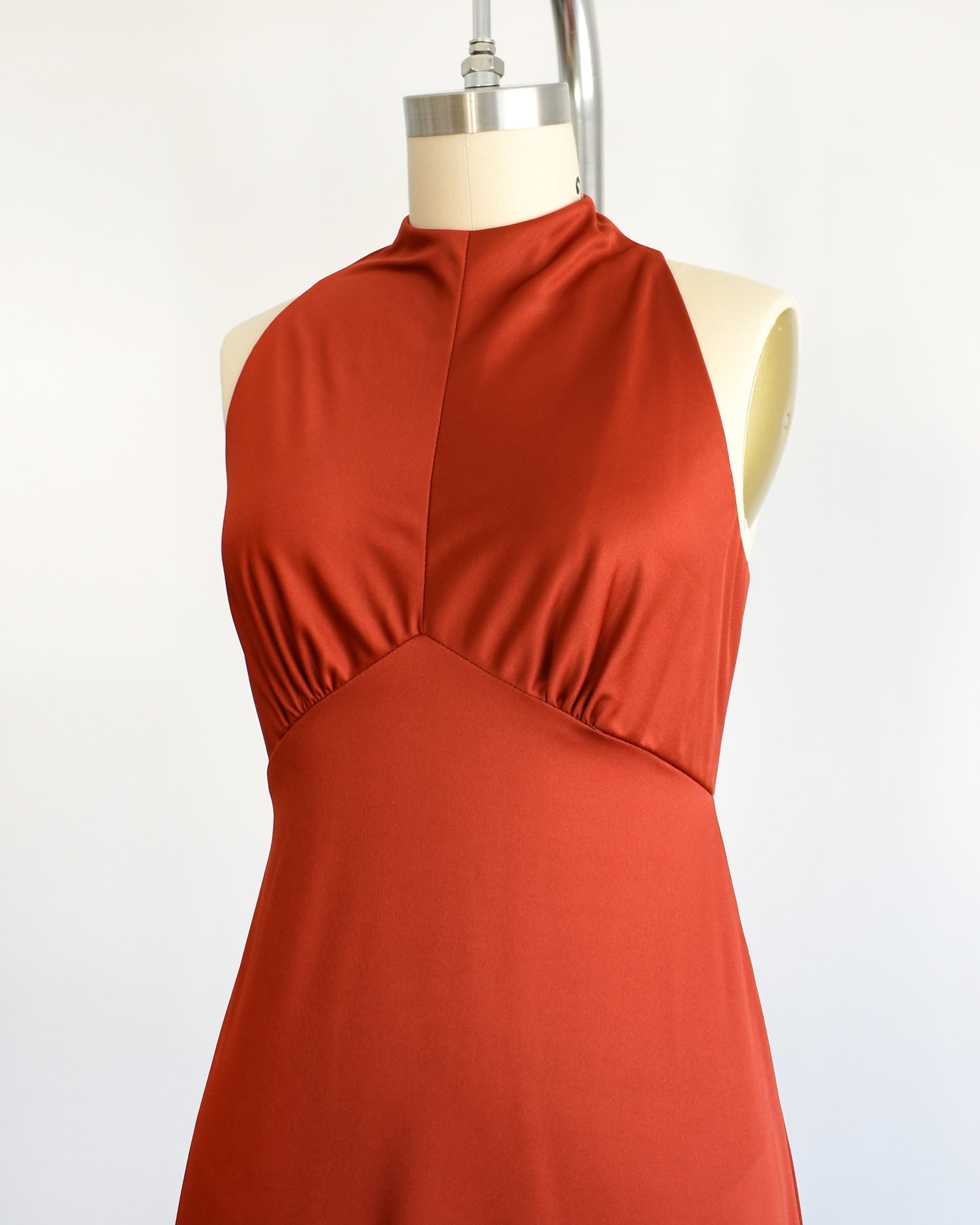 side front view of a vintage 1970s rust red  maxi dress