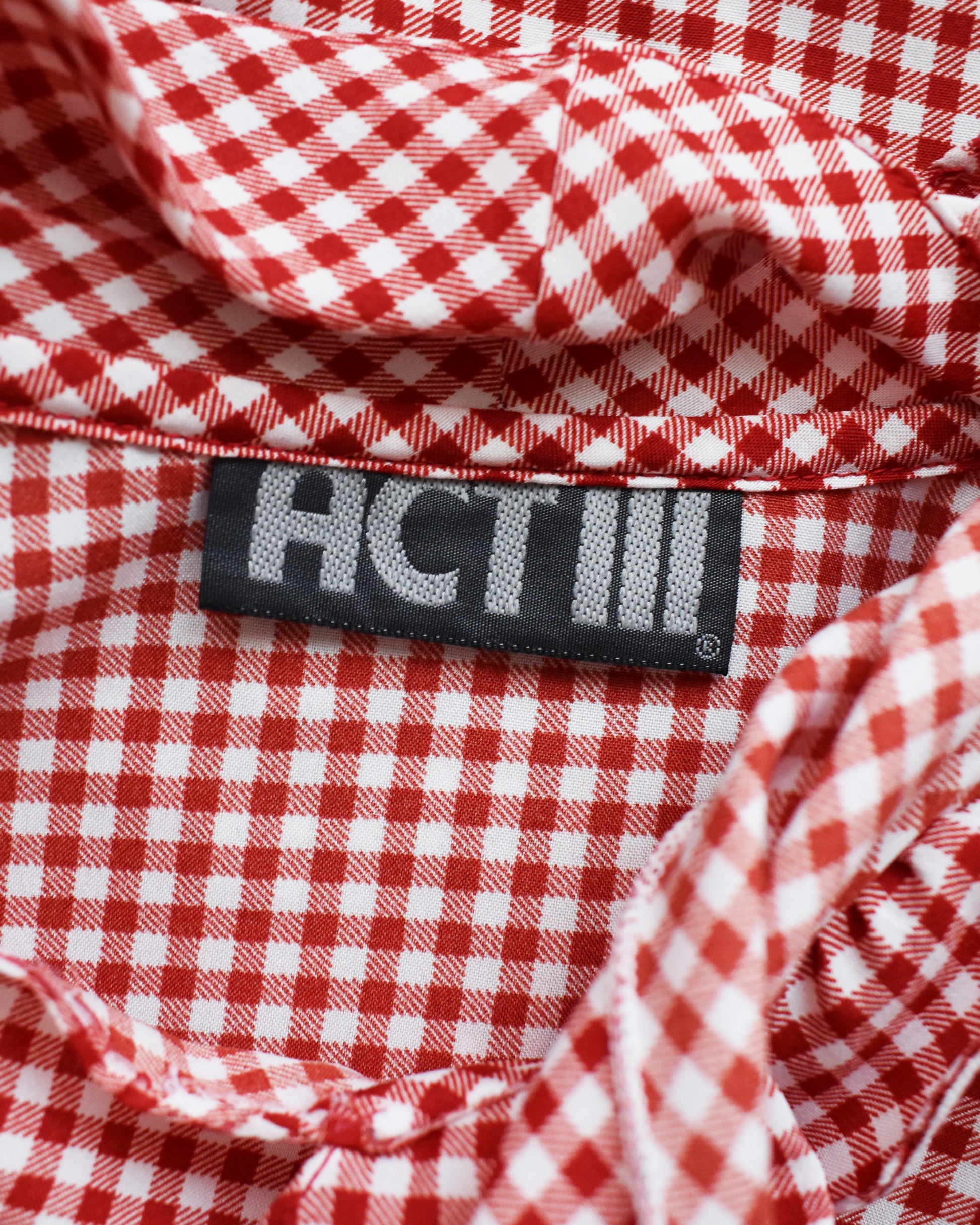 Close up of the tag that says Act III