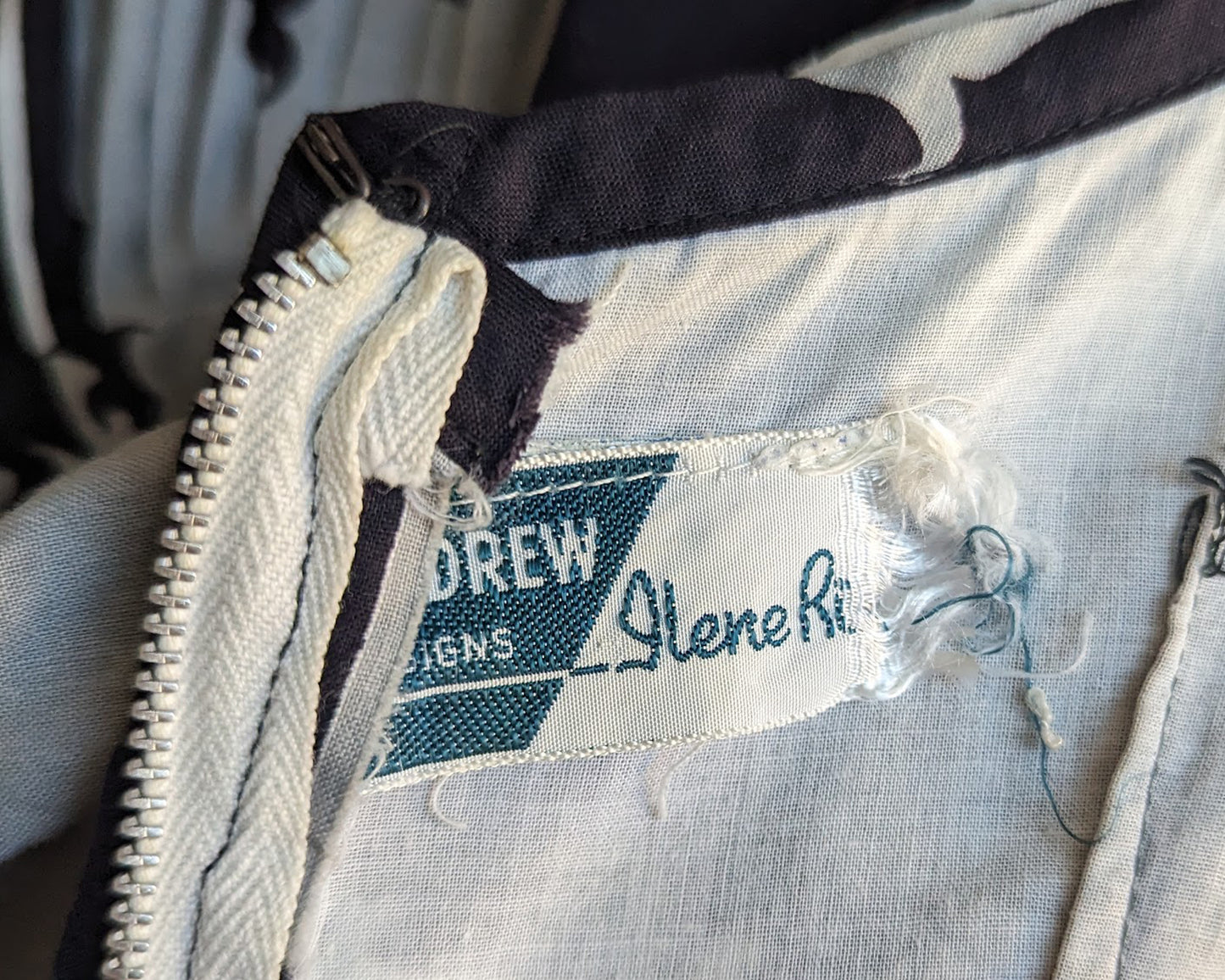 Close up of the label which should say Tom Drew Designs Ilene Ricky (tag is frayed)