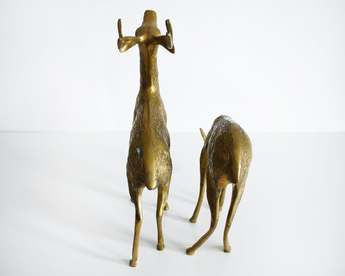 Above view of the vintage brass deer pair