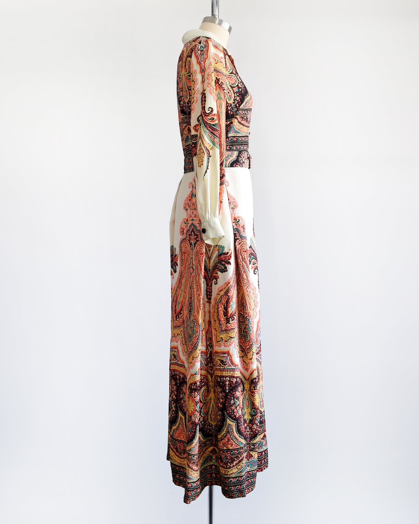 Side view of a vintage 1970s psychedelic paisley maxi dress 