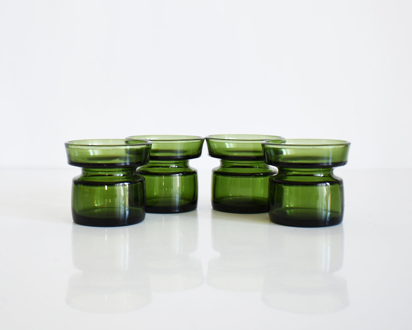 Set of four vintage 1960s green glass  Dansk candle holders.