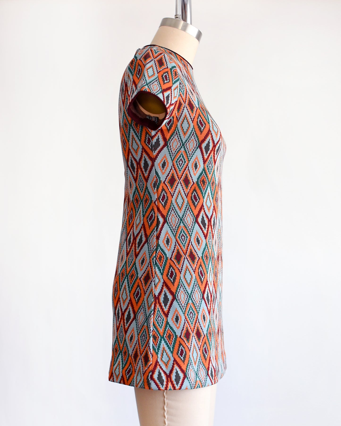 side view of a vintage 1970s diamond print mod dress