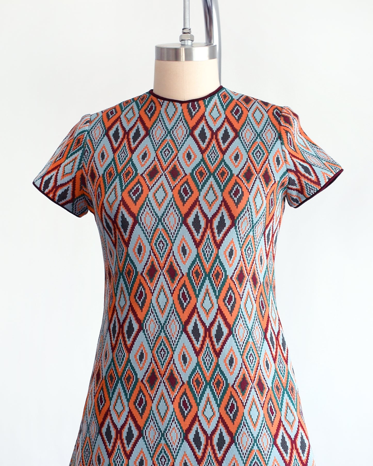 side front view of a vintage 1970s diamond print mod dress