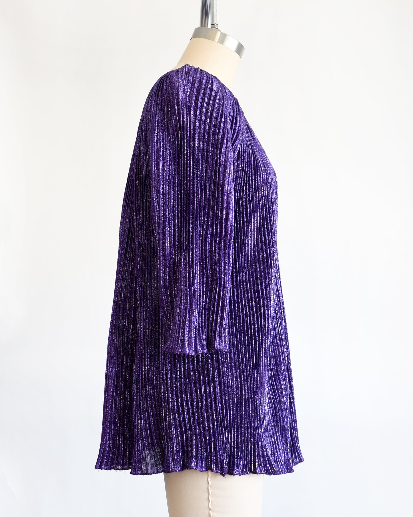 side view of a vintage 1960s metallic purple mini dress/tunic