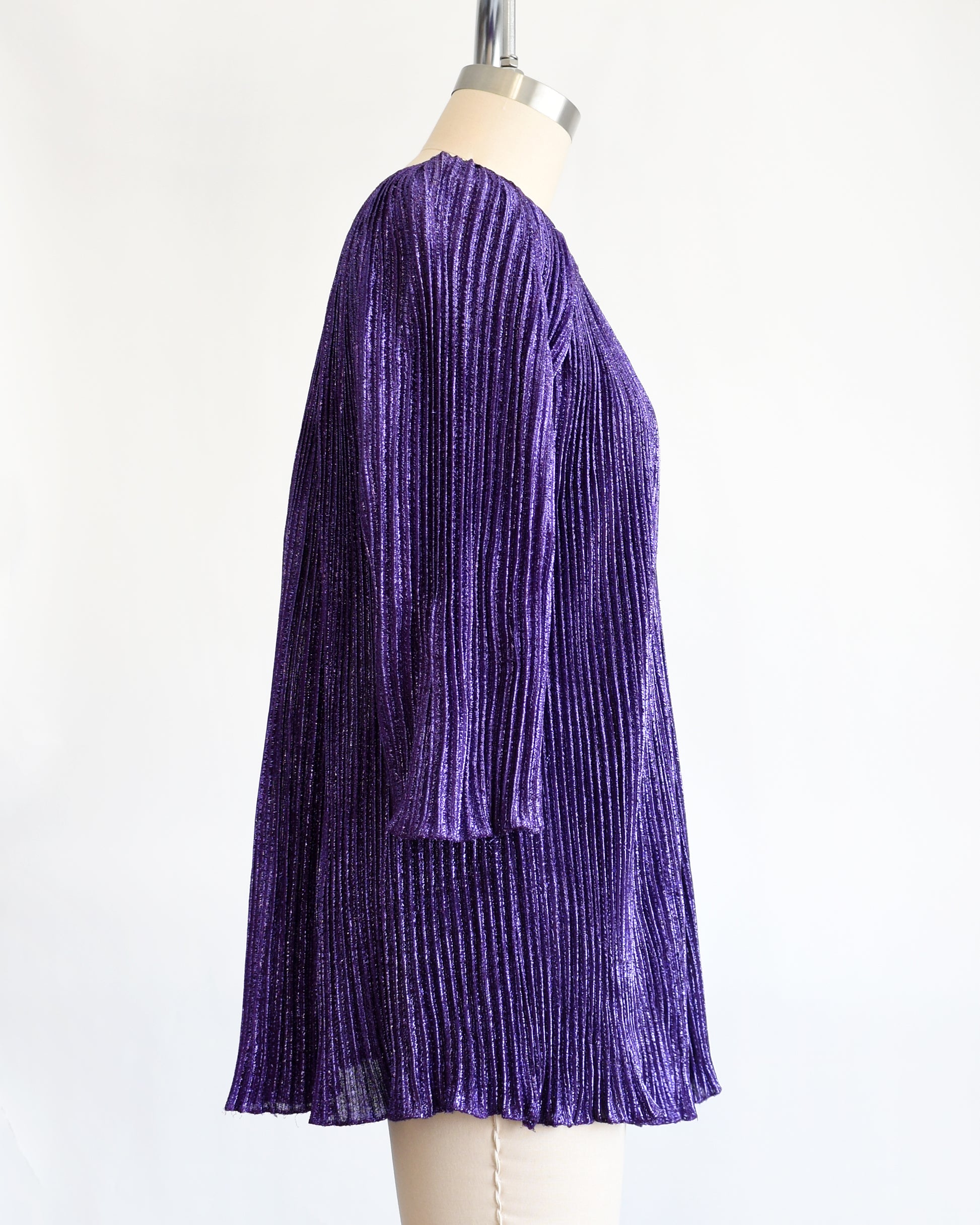 side view of a vintage 1960s metallic purple mini dress/tunic