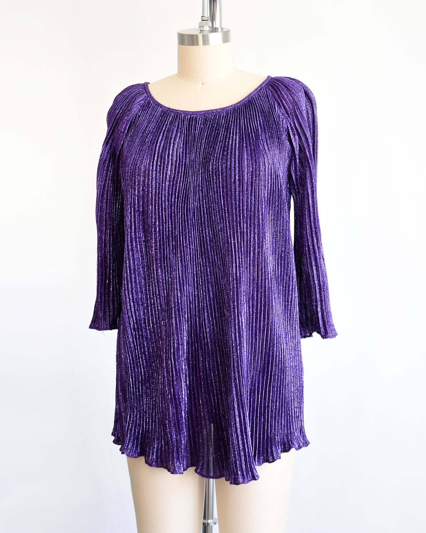 side front view of a vintage 1960s metallic purple mini dress/tunic