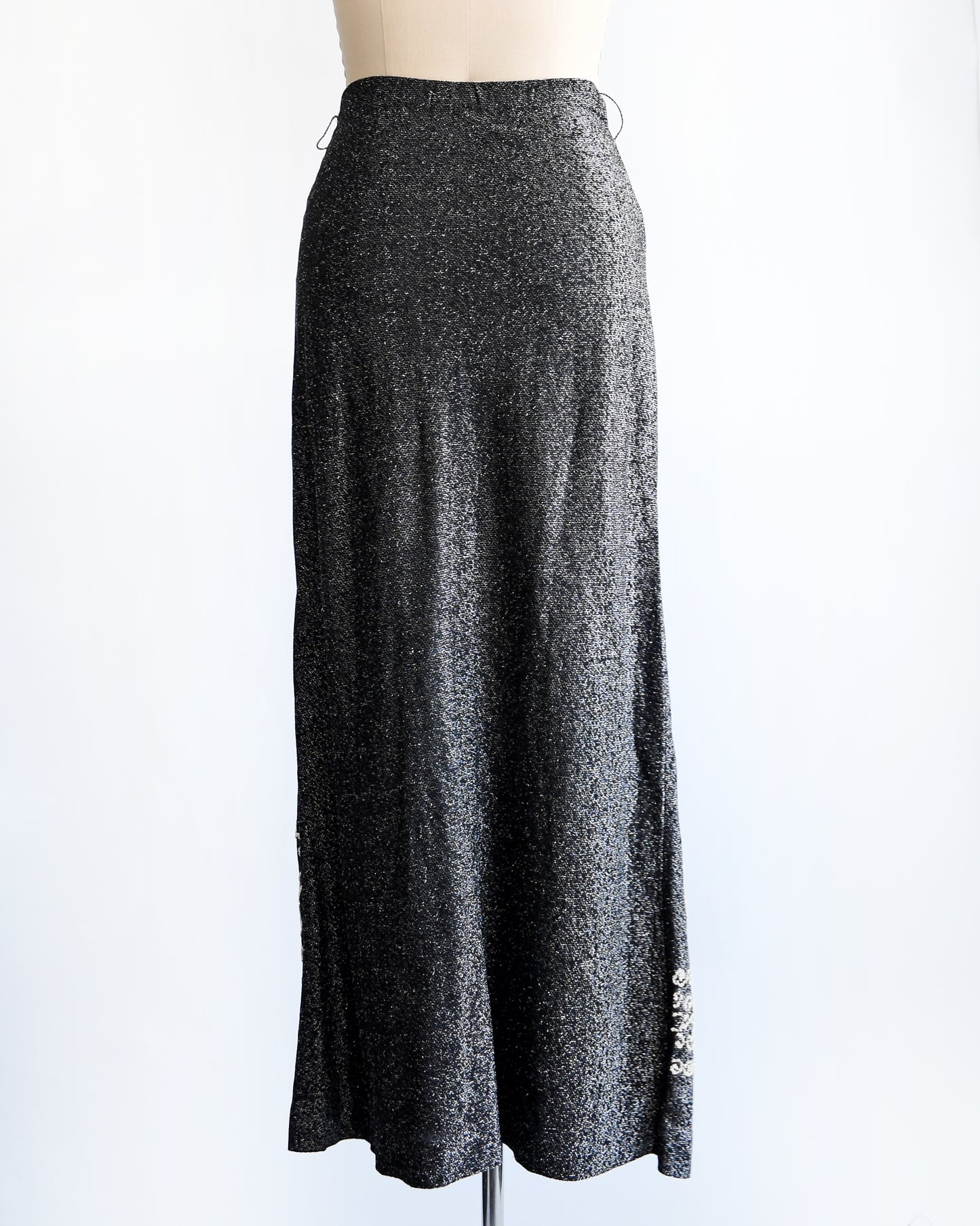 back view of a vintage 1970s black and silver beaded maxi skirt