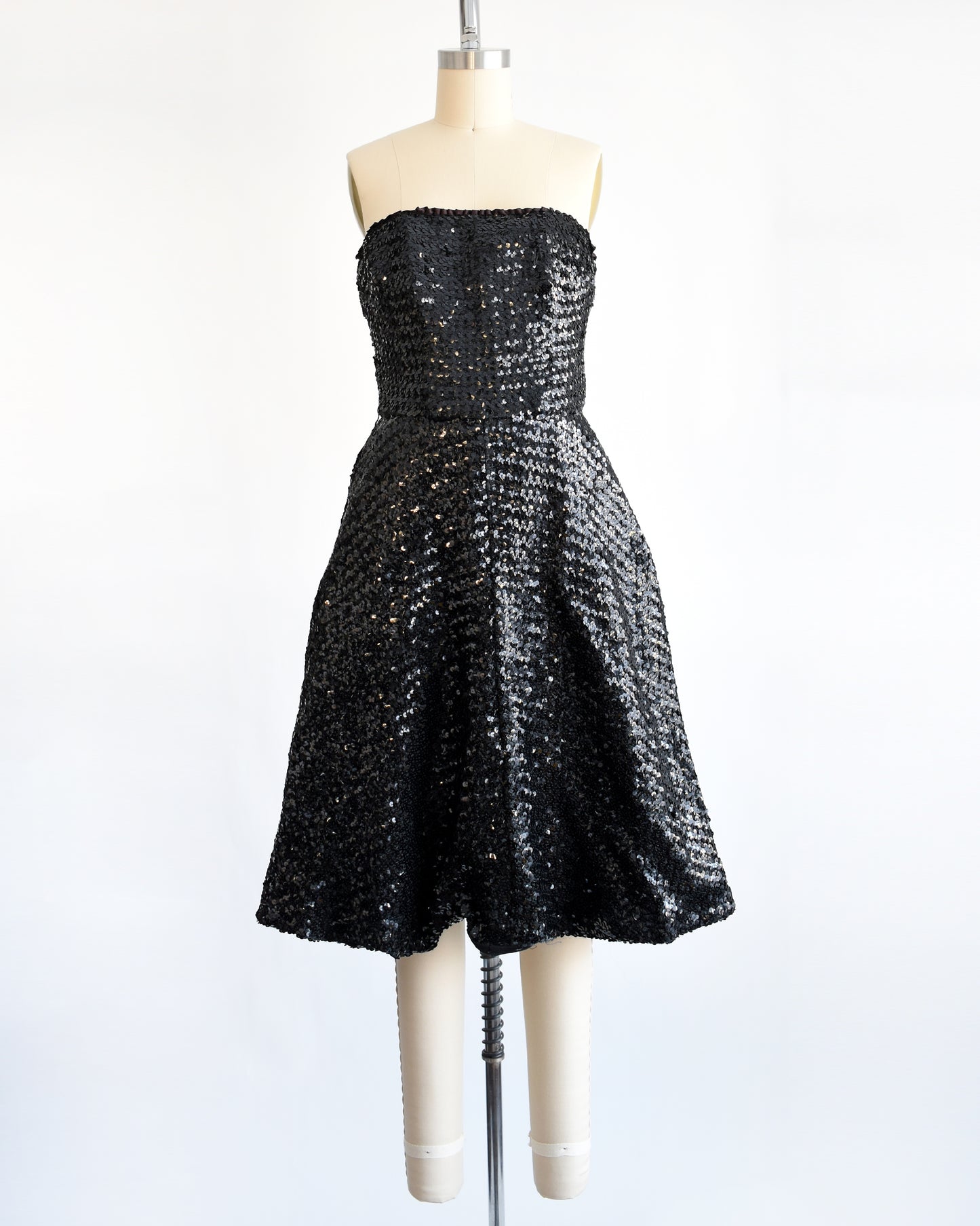 a vintage 1960s black sequin party dress