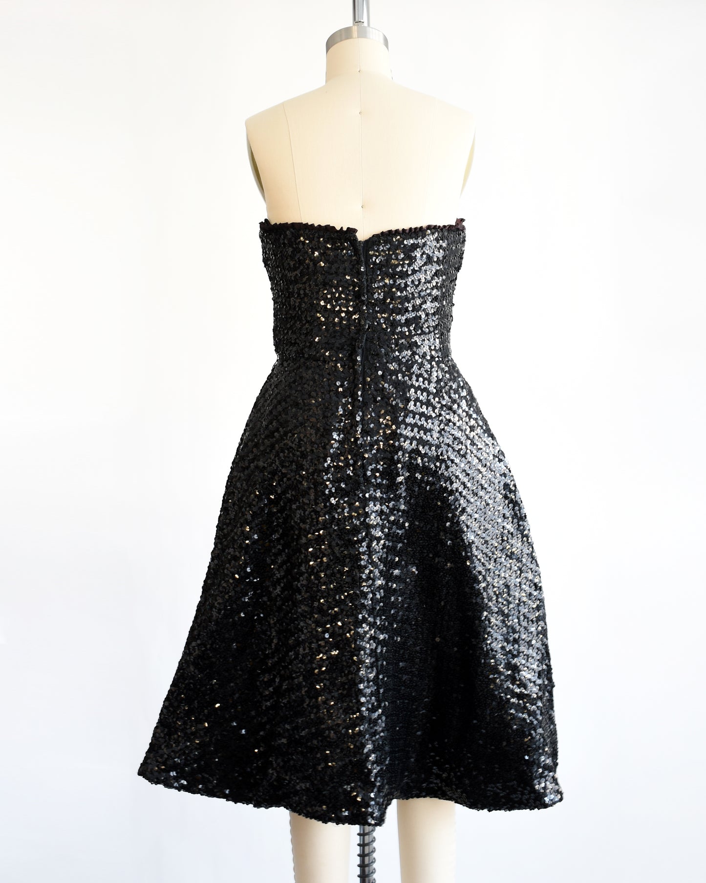 back view of a vintage 1960s black sequin party dress