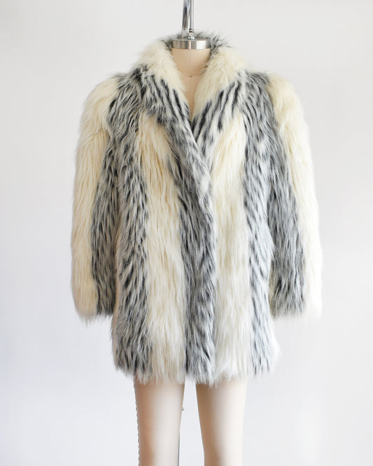 A vintage late 1970s early 1980s white and black striped faux fur coat.