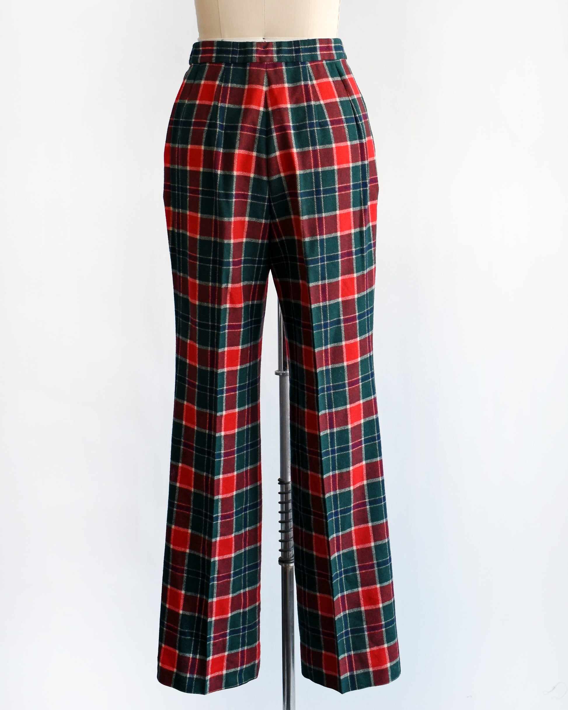 back view of a pair of vintage 1970s red, navy blue, green, and white plaid wool pants by Pendleton.