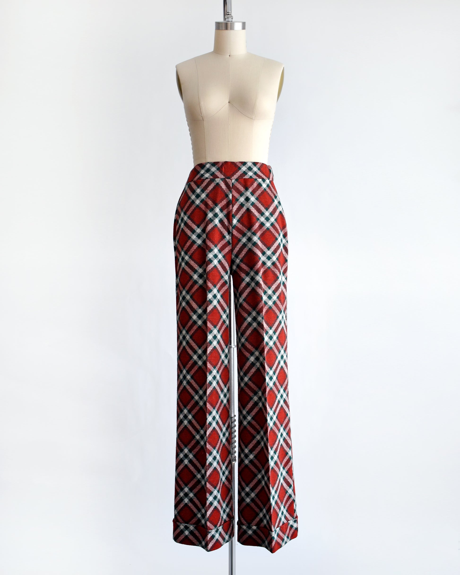 a pair of vintage 1970s red, green, and white plaid wide leg pants