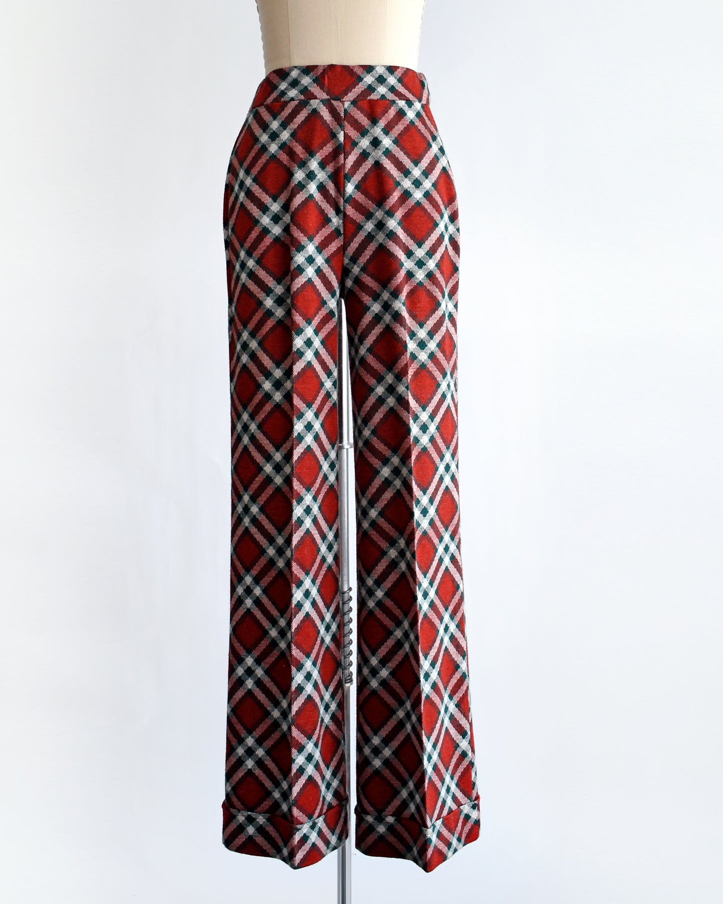 a pair of vintage 1970s red, green, and white plaid wide leg pants