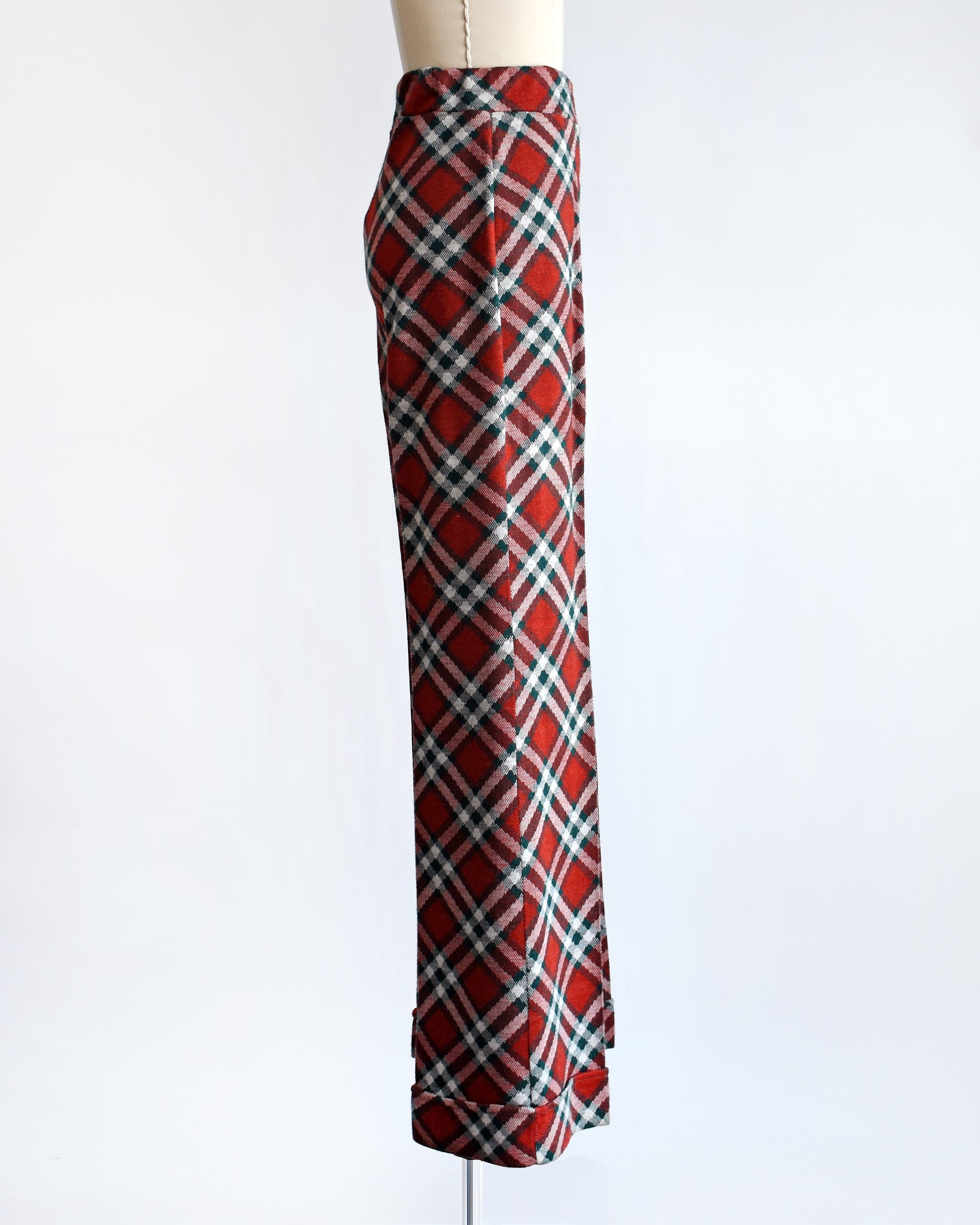 side view of a pair of vintage 1970s red, green, and white plaid wide leg pants