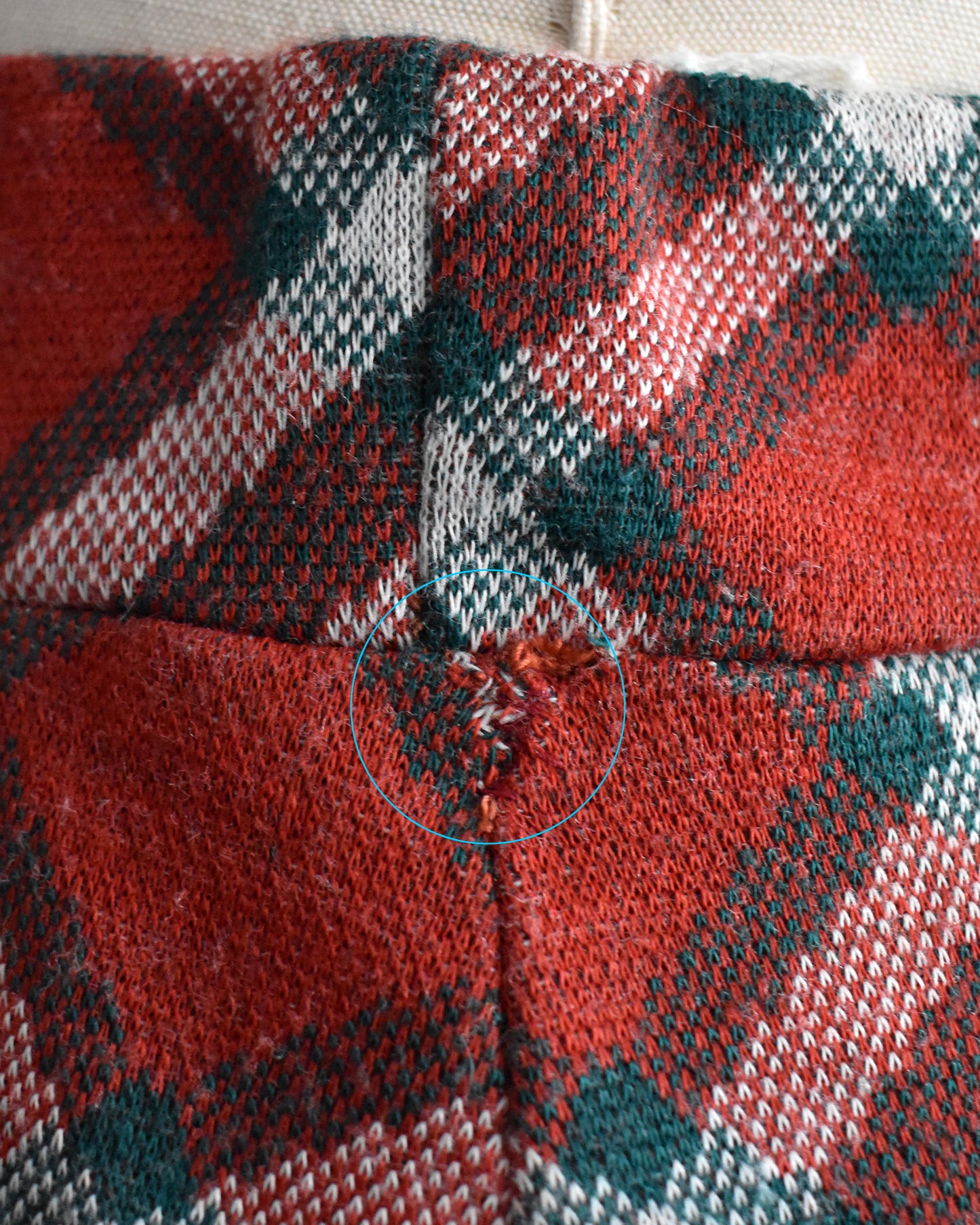 close up of a mend on the side hip of the pants