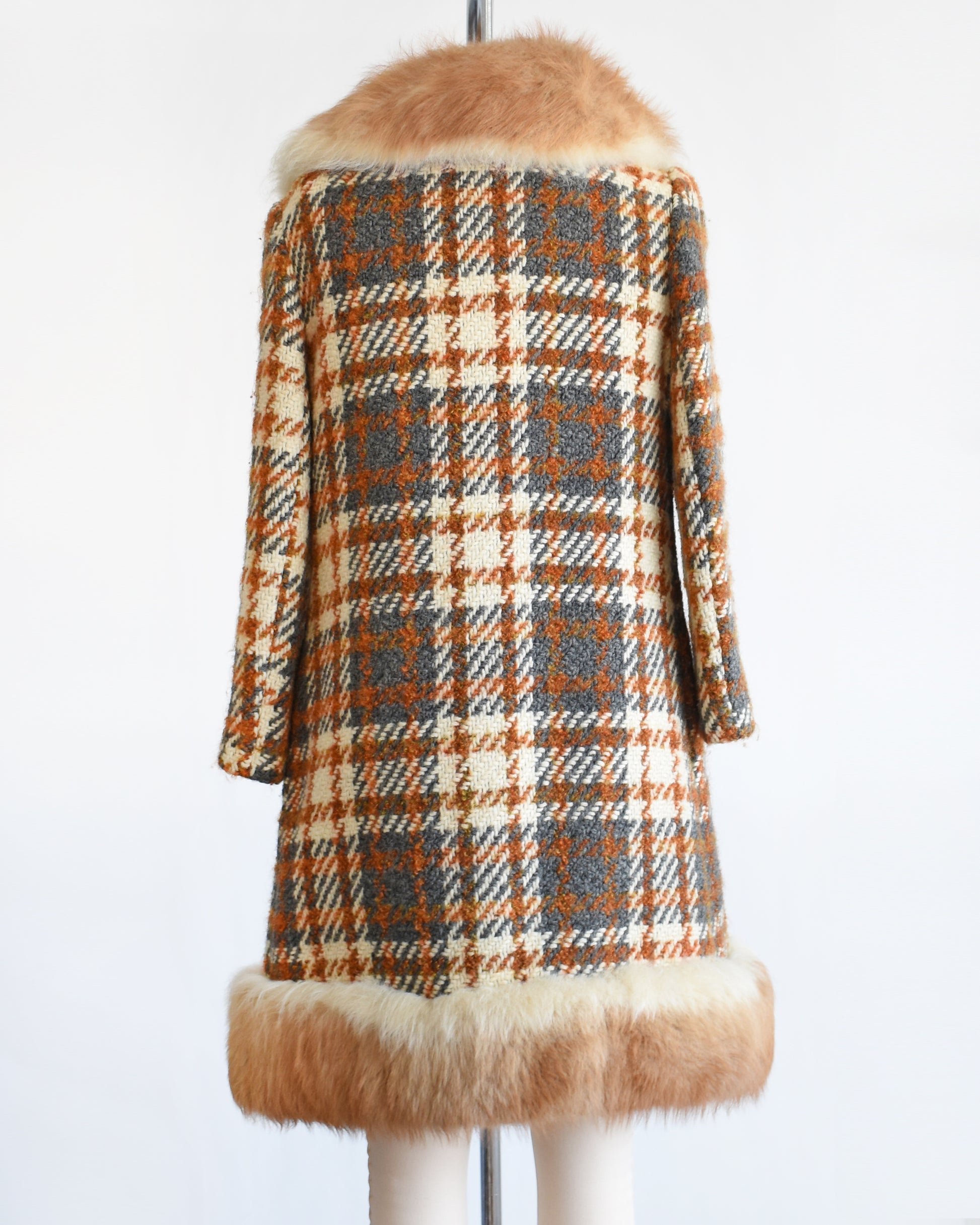 back view of a vintage 1960s plaid wool coat with guanaco fur trim